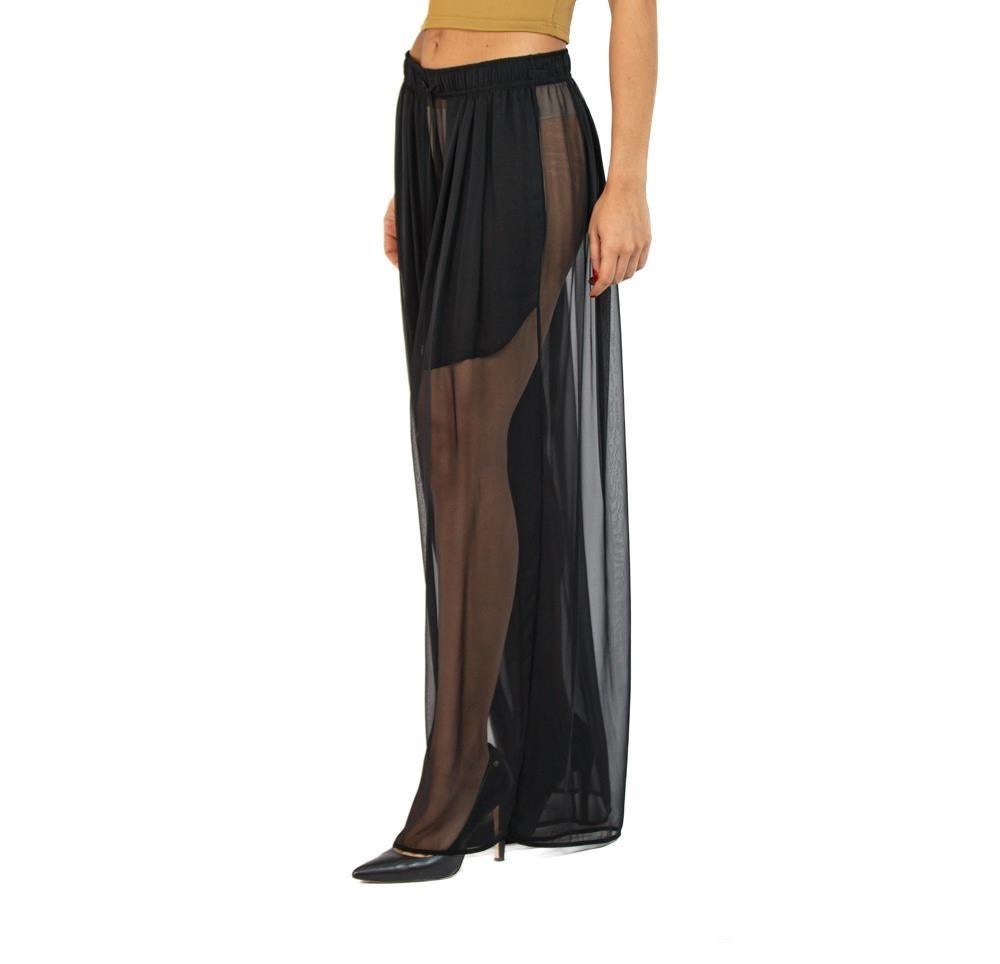 Our wide leg silk pants are like no other out there because they are pleated all the way around the body, set with an elastic waist for comfort and fit. Unstretched the waist will fit sizes  MORPHEW COLLECTION Black Silk Chiffon Oversized Box Pleat
