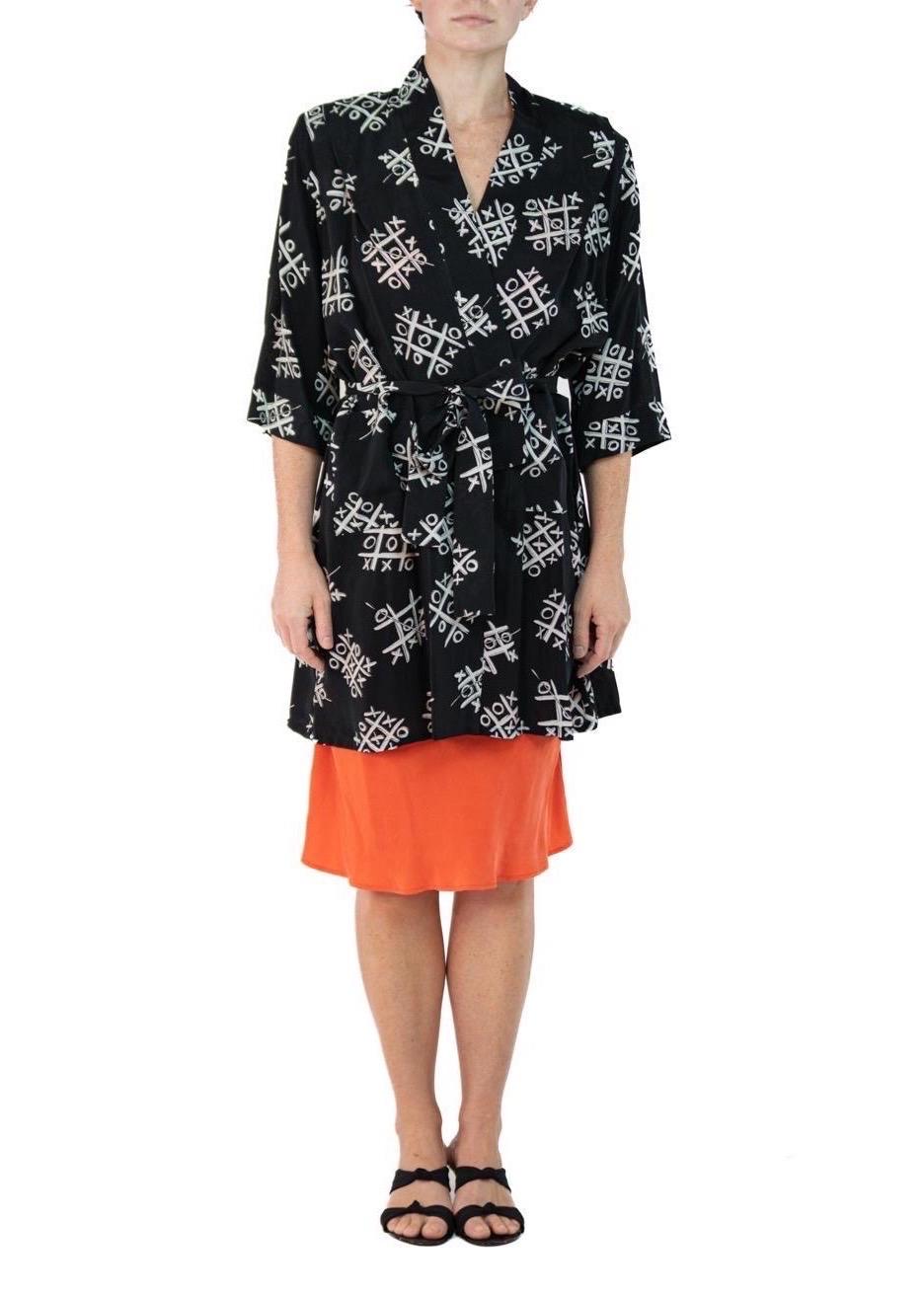 Morphew Collection Black & White Tic Tac Toe Novelty Print Cold Rayon Bias Belted Kimono 
MORPHEW COLLECTION is made entirely by hand in our NYC Ateliér of rare antique materials sourced from around the globe. Our sustainable vintage materials