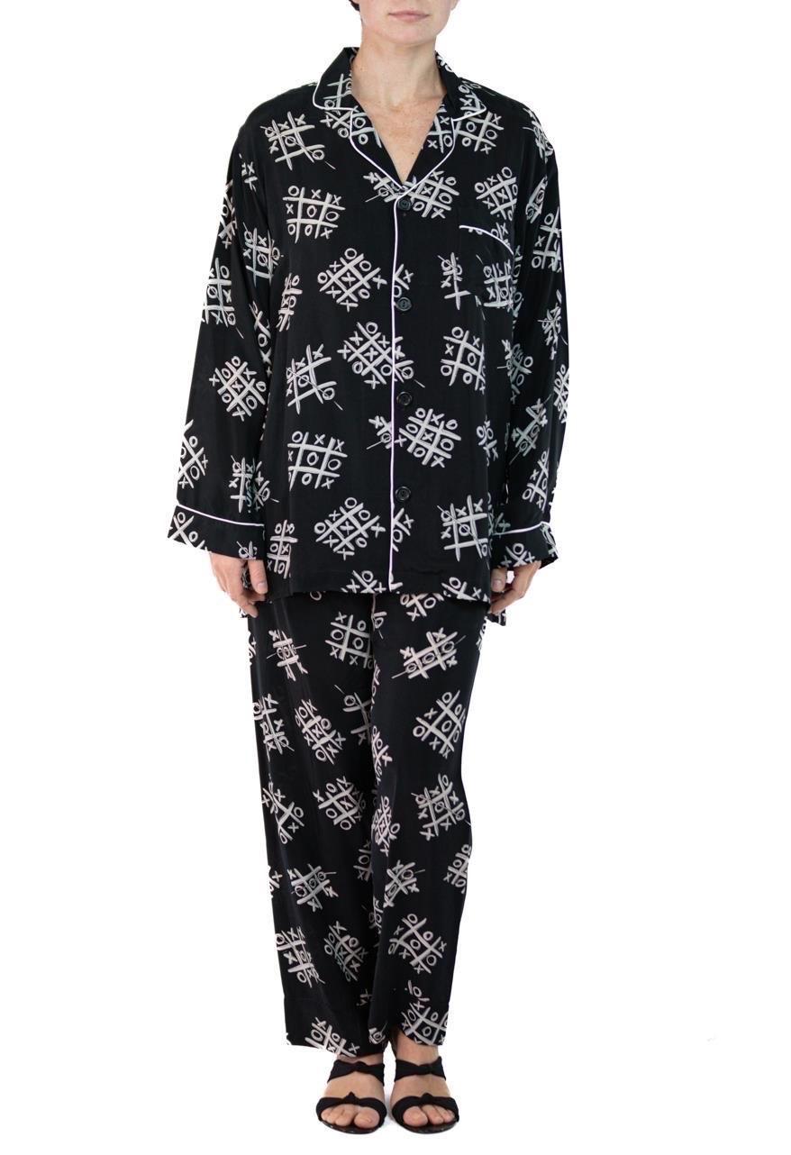 Morphew Collection Black & White Tic Tac Toe Novelty Print Cold Rayon Bias Pajamas
MORPHEW COLLECTION is made entirely by hand in our NYC Ateliér of rare antique materials sourced from around the globe. Our sustainable vintage materials represent