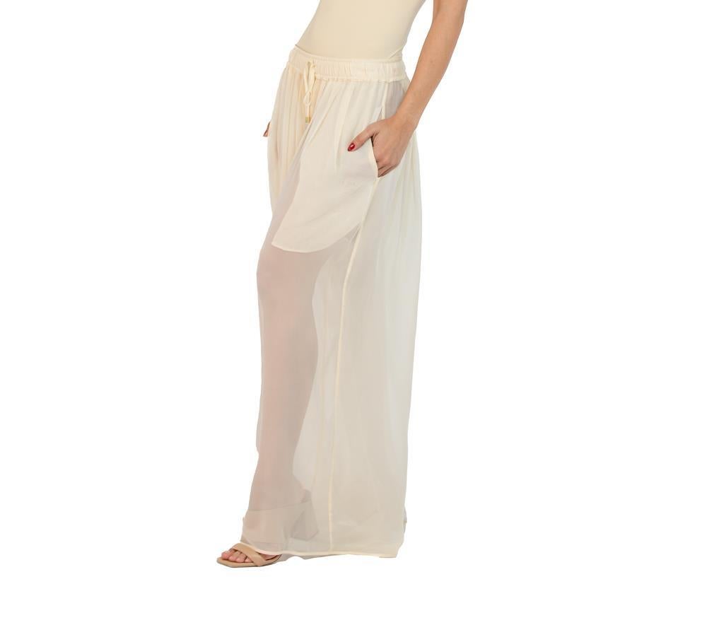 Our wide leg silk pants are like no other out there because they are pleated all the way around the body, set with an elastic waist for comfort and fit. Unstretched the waist will fit sizes  MORPHEW COLLECTION Champagne Silk Chiffon Oversized Box