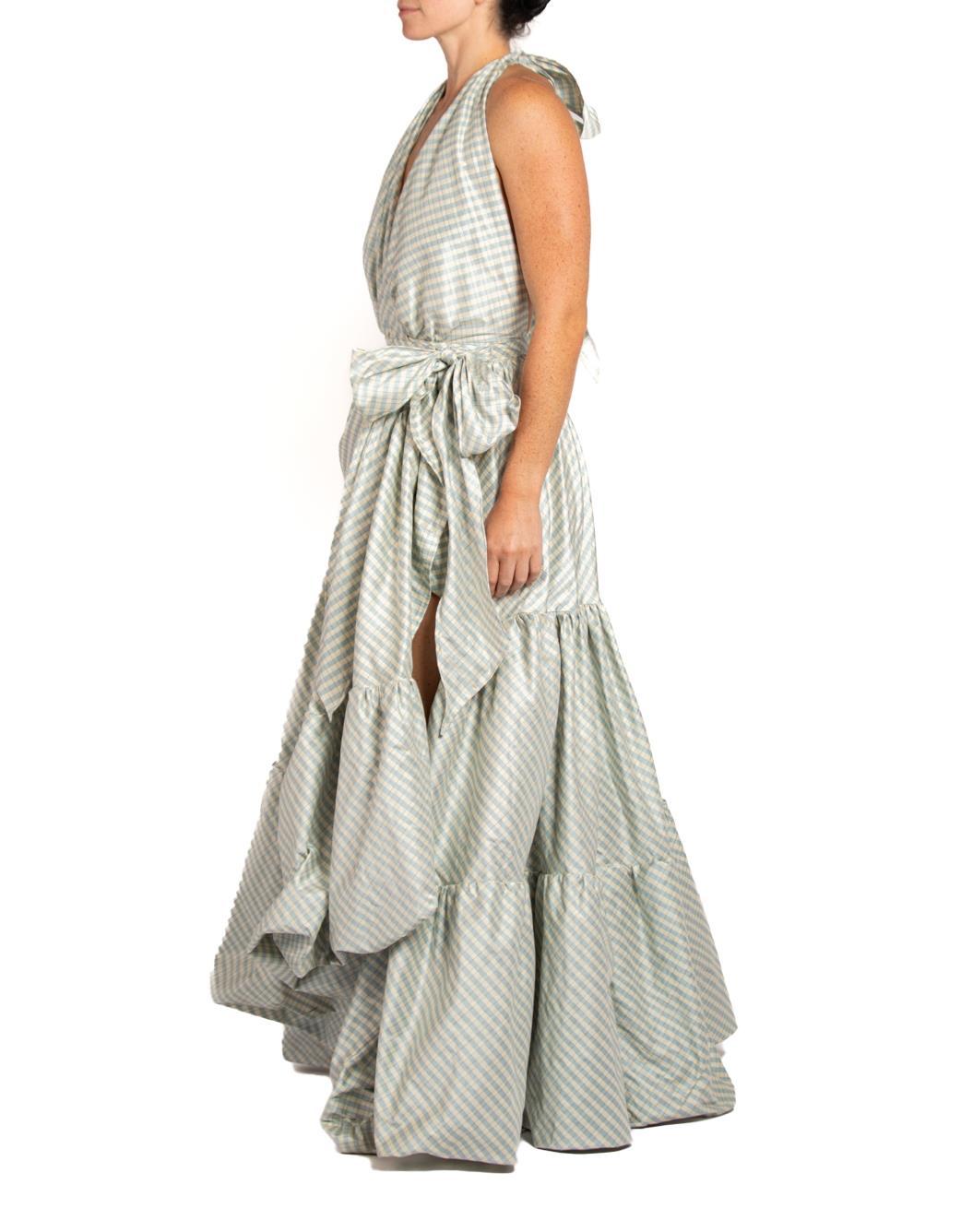 MORPHEW COLLECTION Cream & Blue Silk Taffeta Plaid Gown
MORPHEW COLLECTION is made entirely by hand in our NYC Ateliér of rare antique materials sourced from around the globe. Our sustainable vintage materials represent over a century of design,
