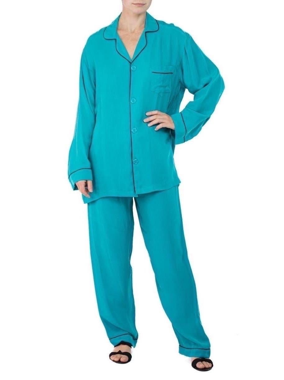 Morphew Collection Dark Teal With Indigo Trim Cold Rayon Bias Pajamas
MORPHEW COLLECTION is made entirely by hand in our NYC Ateliér of rare antique materials sourced from around the globe. Our sustainable vintage materials represent over a century