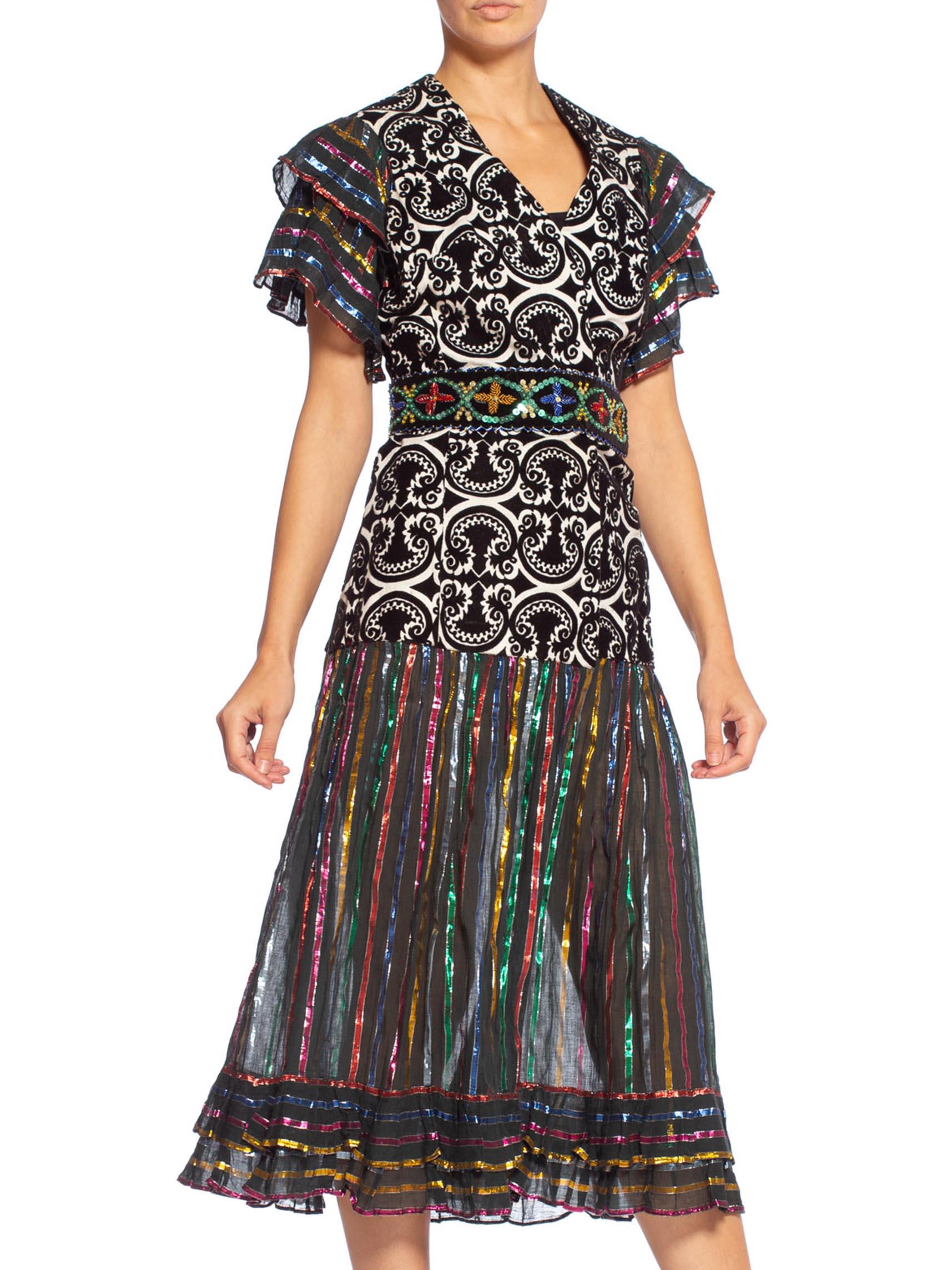 MORPHEW COLLECTION Duster Wrap Dress Made From 70'S Lurex & Velvet Fabrics With Detachable Beaded Belt
MORPHEW COLLECTION is made entirely by hand in our NYC Ateliér of rare antique materials sourced from around the globe. Our sustainable vintage