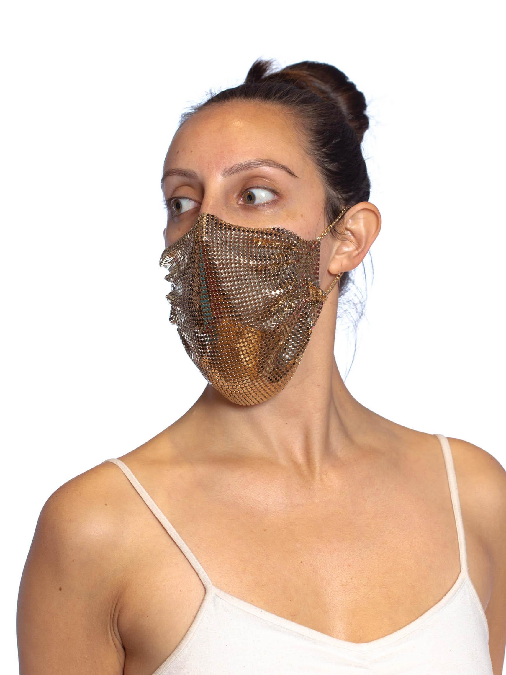 MORPHEW COLLECTION Gold Metal Mesh Scarf Mask
MORPHEW COLLECTION is made entirely by hand in our NYC Ateliér of rare antique materials sourced from around the globe. Our sustainable vintage materials represent over a century of design, many of the