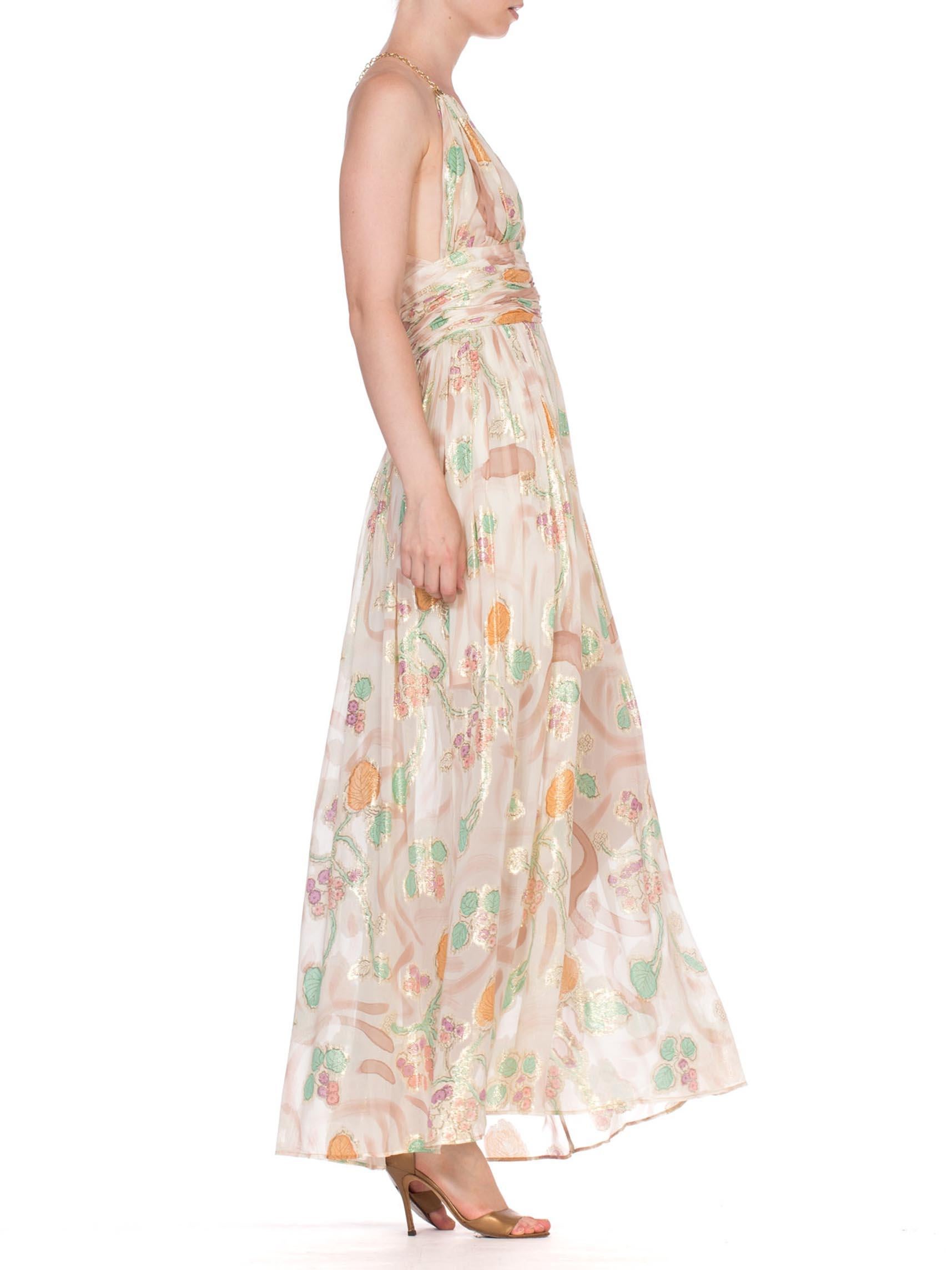 MORPHEW COLLECTION Hand Painted Silk Lurex Fil Coupé  Chiffon Gown With Gold Chain Straps
MORPHEW COLLECTION is made entirely by hand in our NYC Ateliér of rare antique materials sourced from around the globe. Our sustainable vintage materials