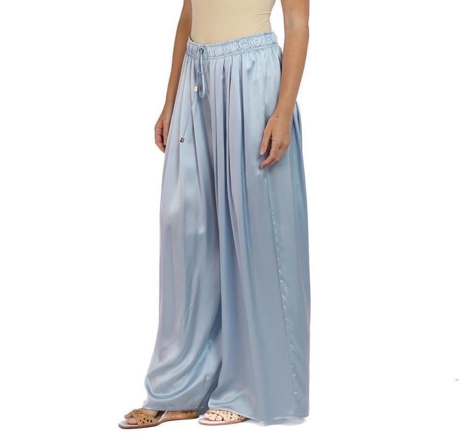 Our wide leg silk pants are like no other out there because they are pleated all the way around the body, set with an elastic waist for comfort and fit. Unstretched the waist will fit sizes  Morphew Collection Ice Blue Silk Charmeuse Oversized Box