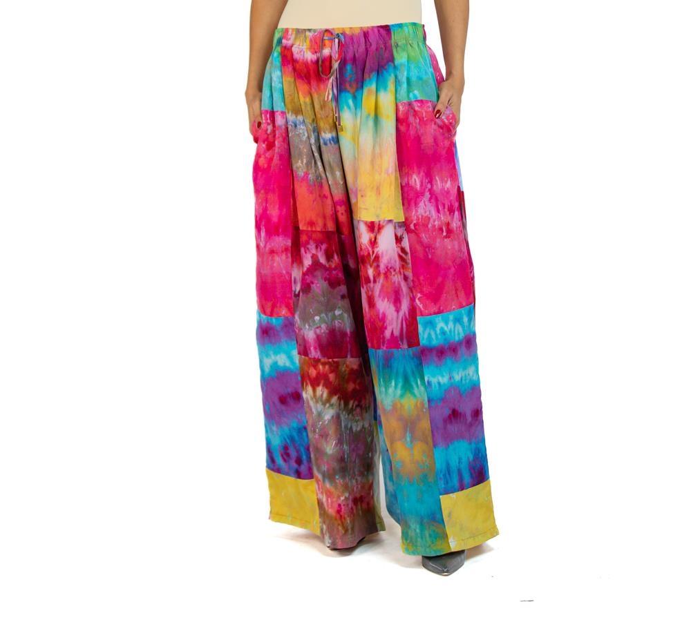 Our wide leg silk pants are like no other out there because they are pleated all the way around the body, set with an elastic waist for comfort and fit. Unstretched the waist will fit sizes  MORPHEW COLLECTION Ice Dyed Silk Oversized Box Pleat Pants