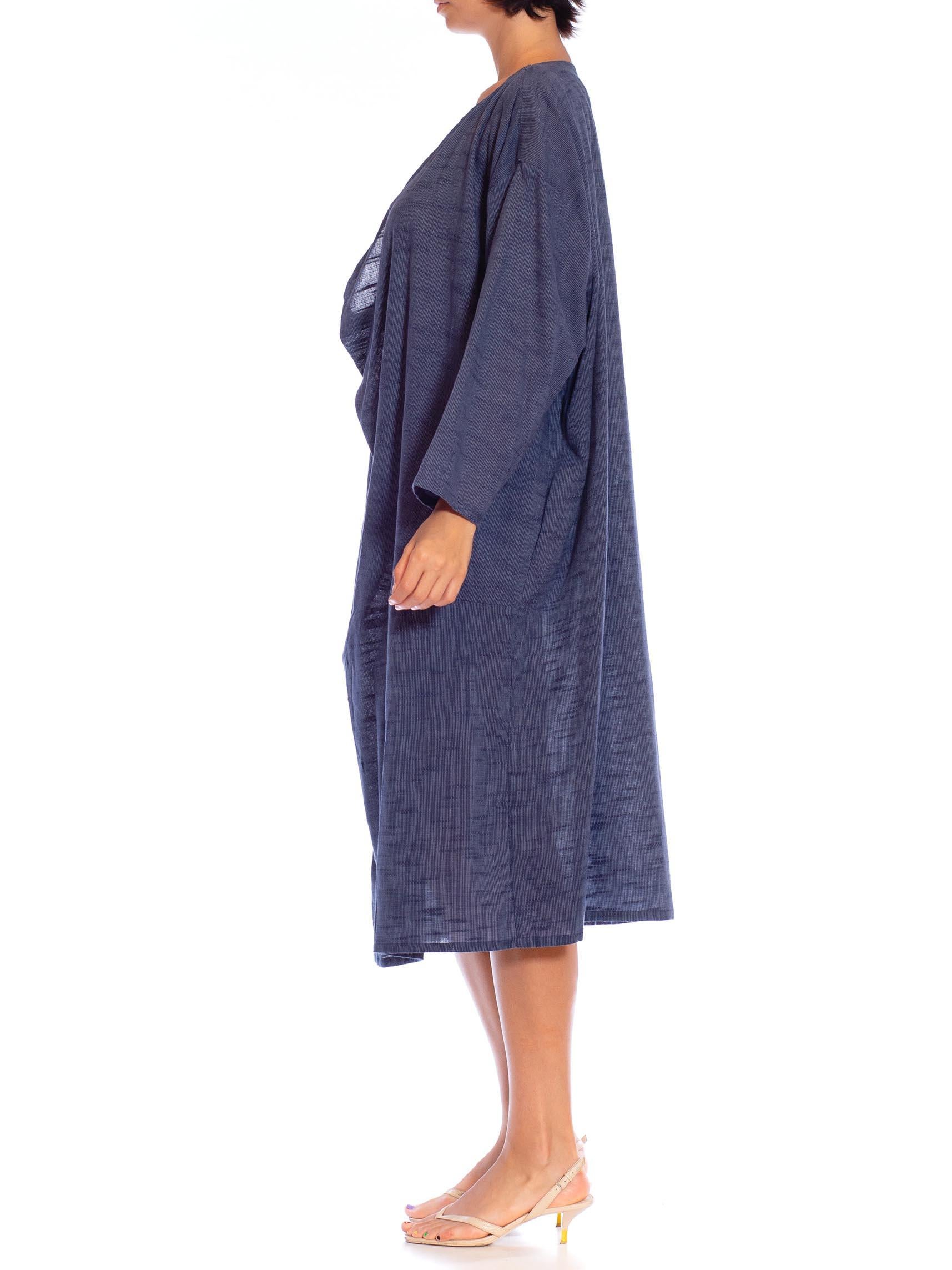 MORPHEW COLLECTION Indigo Blue Cotton Unisex Cowl Neck Tunic Kaftan
MORPHEW COLLECTION is made entirely by hand in our NYC Ateliér of rare antique materials sourced from around the globe. Our sustainable vintage materials represent over a century of