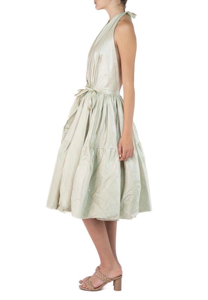 Fits sizes 2 to 12 with an adjustable waist. Morphew Collection Light Green Silk Taffeta Dress 
MORPHEW COLLECTION is made entirely by hand in our NYC Ateliér of rare antique materials sourced from around the globe. Our sustainable vintage materials