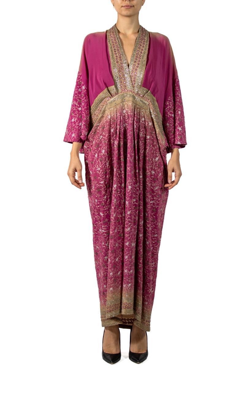 MORPHEW COLLECTION Magenta & Beige Indian Sari Silk Butterfly Sleeve Kaftan Dress With Gold Embroidery
MORPHEW COLLECTION is made entirely by hand in our NYC Ateliér of rare antique materials sourced from around the globe. Our sustainable vintage