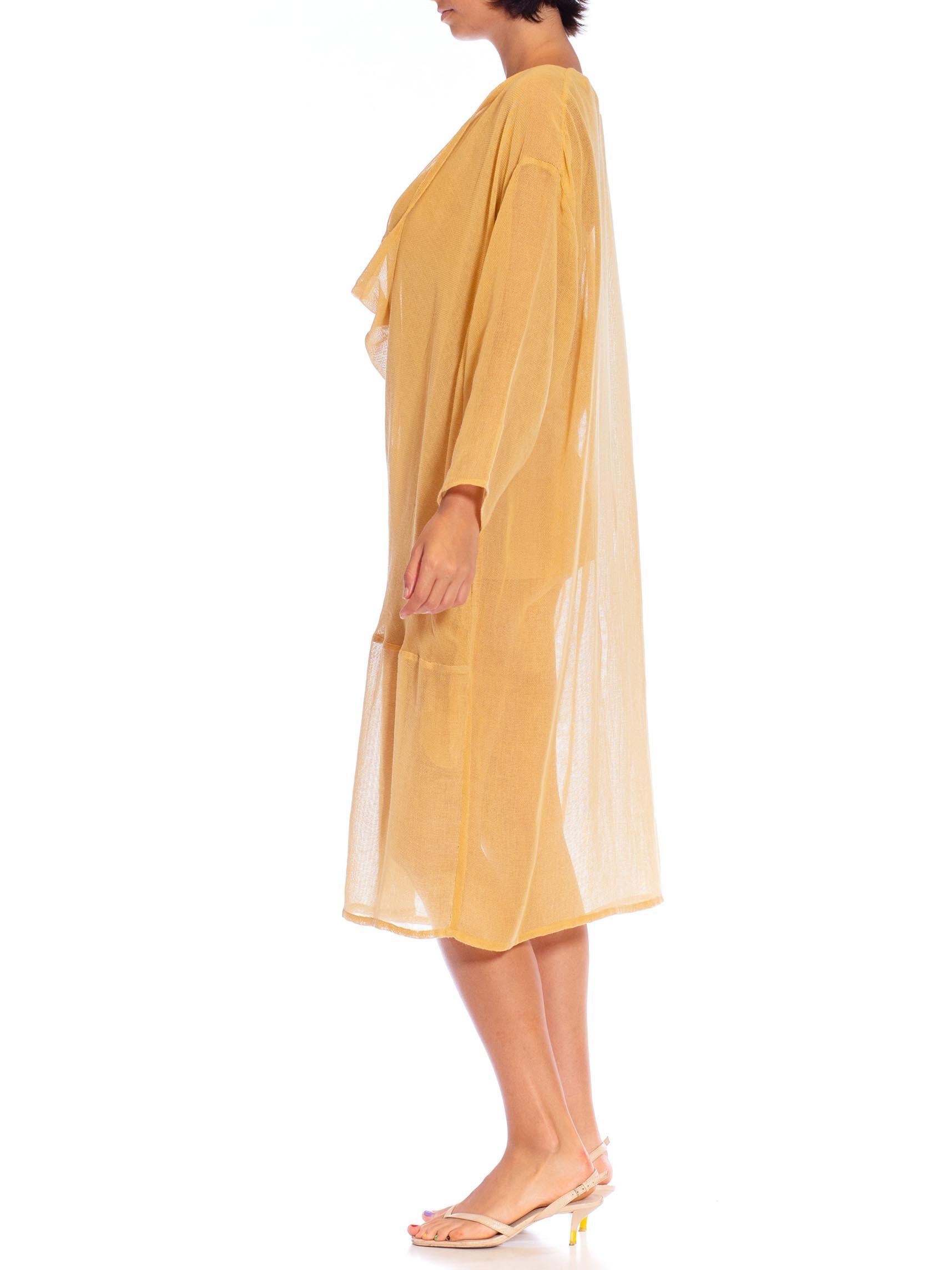 Made from vintage deadstock fabric from the 1970s, french seamed with pockets. MORPHEW COLLECTION Mustard Yellow Cotton Blend Gauze Unisex Cowl-Neck Tunic Top 
MORPHEW COLLECTION is made entirely by hand in our NYC Ateliér of rare antique materials
