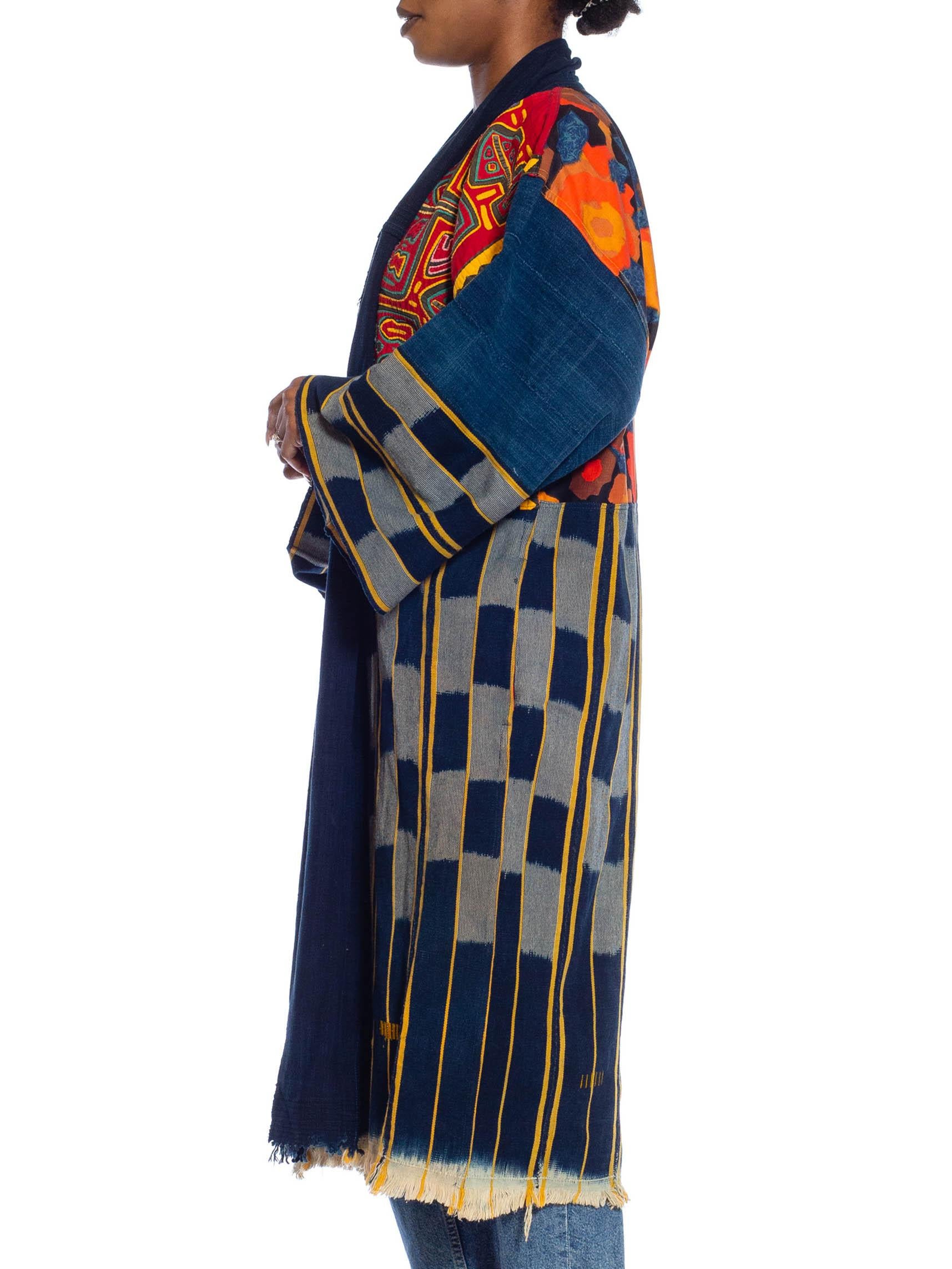 Made from up-cycled vintage fabrics so there are a few areas showing patinated wear. MORPHEW COLLECTION Navy Blue, Red & Orange African Cotton Indigo Duster With Central American Hand Appliqué Work 
MORPHEW COLLECTION is made entirely by hand in our