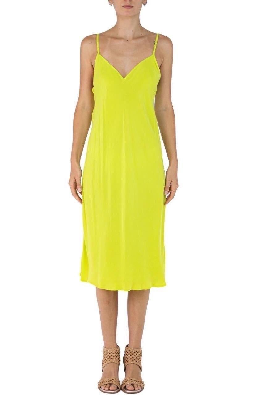 Morphew Collection Neon Green Cold Rayon Bias  Slip Dress
MORPHEW COLLECTION is made entirely by hand in our NYC Ateliér of rare antique materials sourced from around the globe. Our sustainable vintage materials represent over a century of design,
