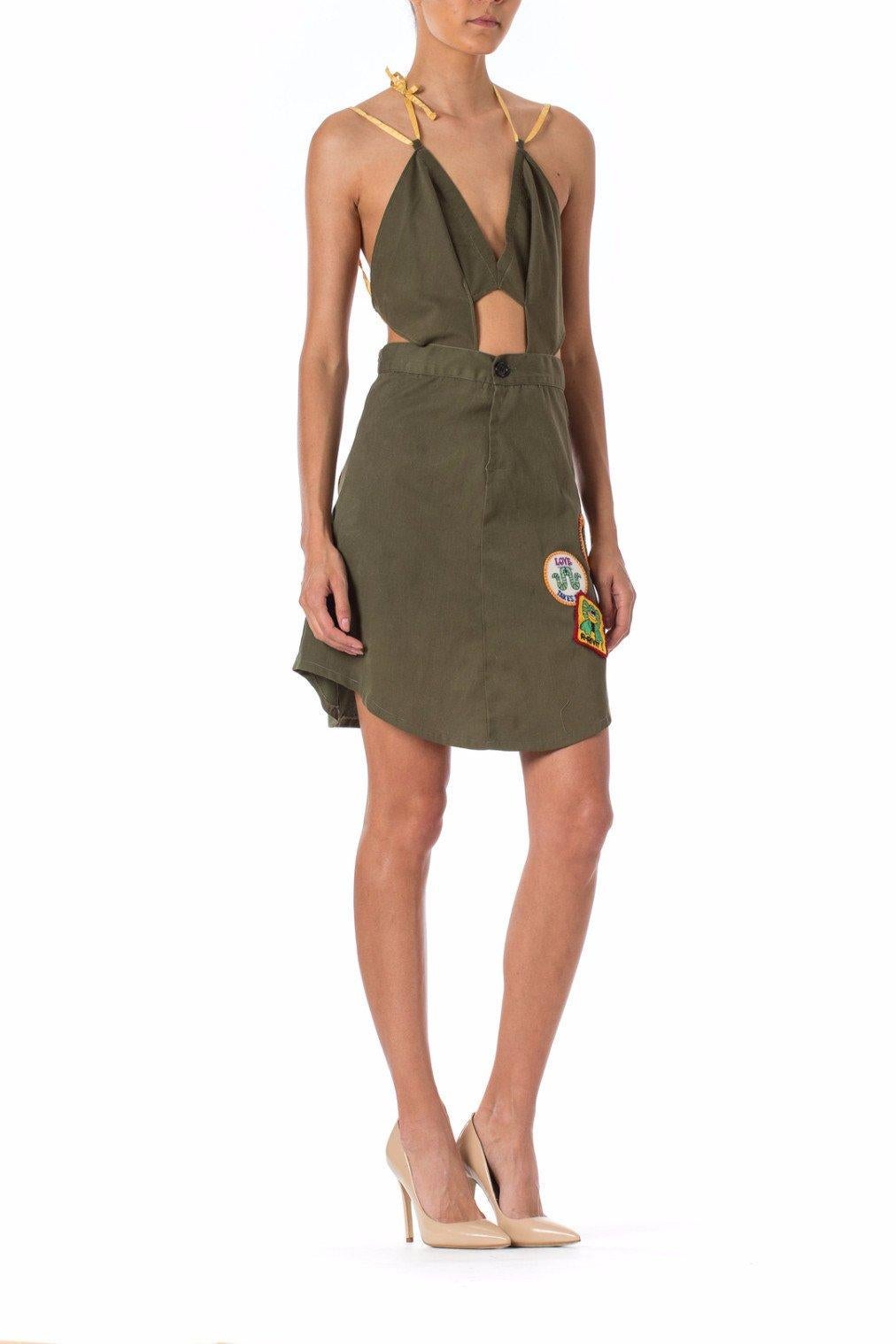 MORPHEW COLLECTION Olive Green Cotton Cut Out Dress Made From Vietnam War Era Surplus Fabric & Vintage Patches
MORPHEW COLLECTION is made entirely by hand in our NYC Ateliér of rare antique materials sourced from around the globe. Our sustainable