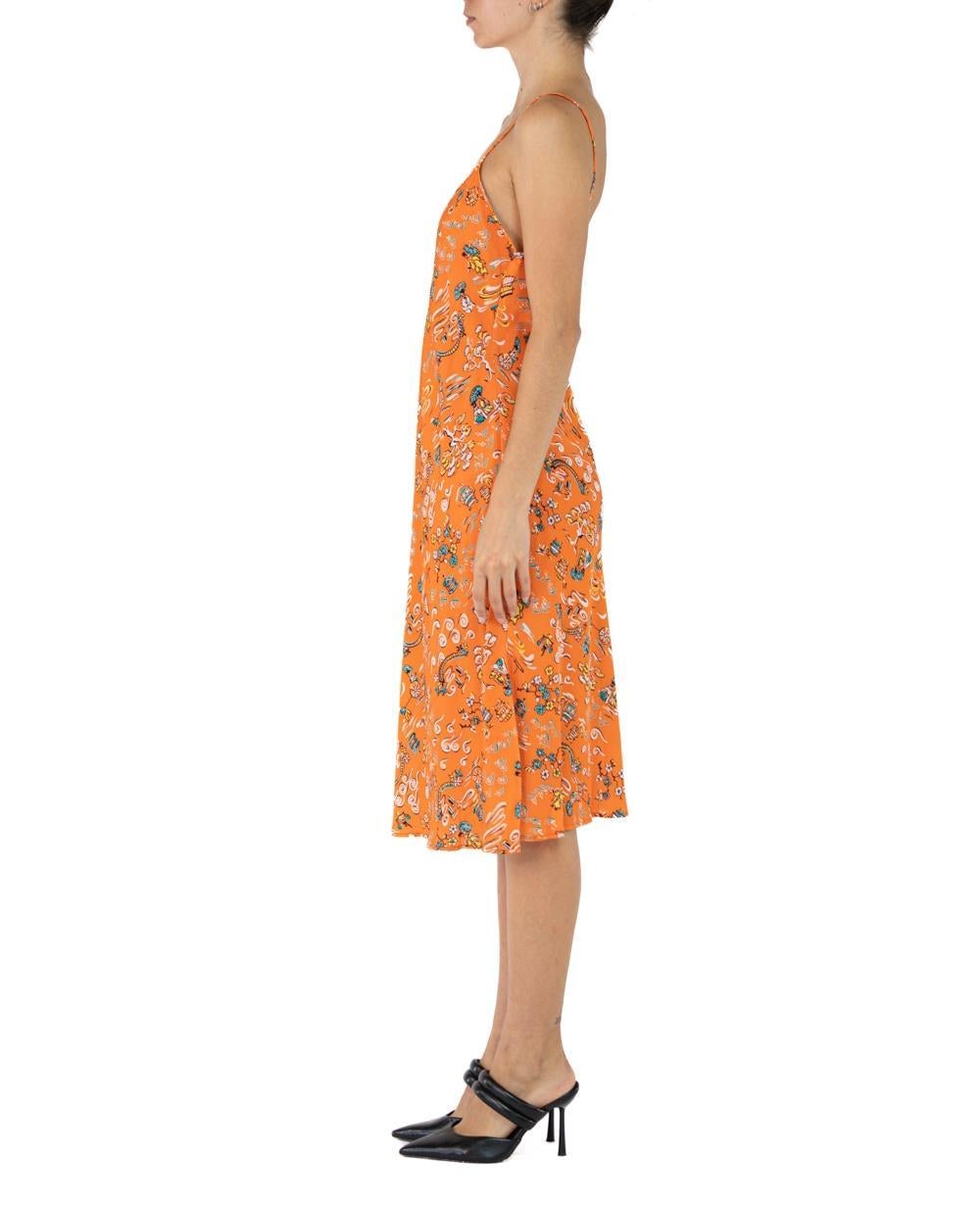 Morphew Collection Orange & Green Cherry Blossom Novelty Print Cold Rayon Bias  Slip Dress Master Medium
MORPHEW COLLECTION is made entirely by hand in our NYC Ateliér of rare antique materials sourced from around the globe. Our sustainable vintage