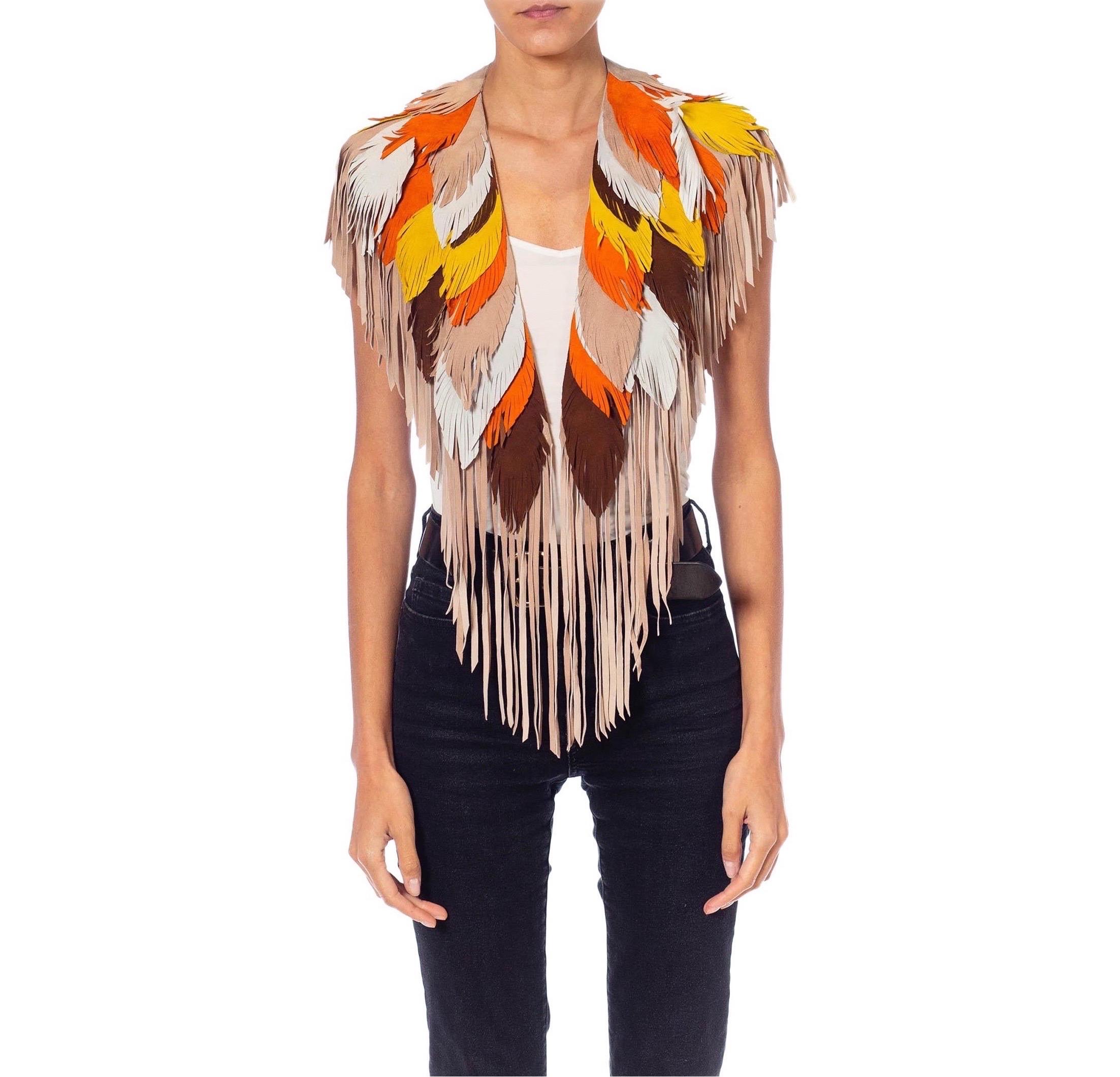 Each Feather-Leather is made by hand by our friends in Columbia in their co-op owned and operated facilities.  MORPHEW COLLECTION Phoenix Sunset Suede Fringe Feather Leather Cape 
MORPHEW COLLECTION is made entirely by hand in our NYC Ateliér of