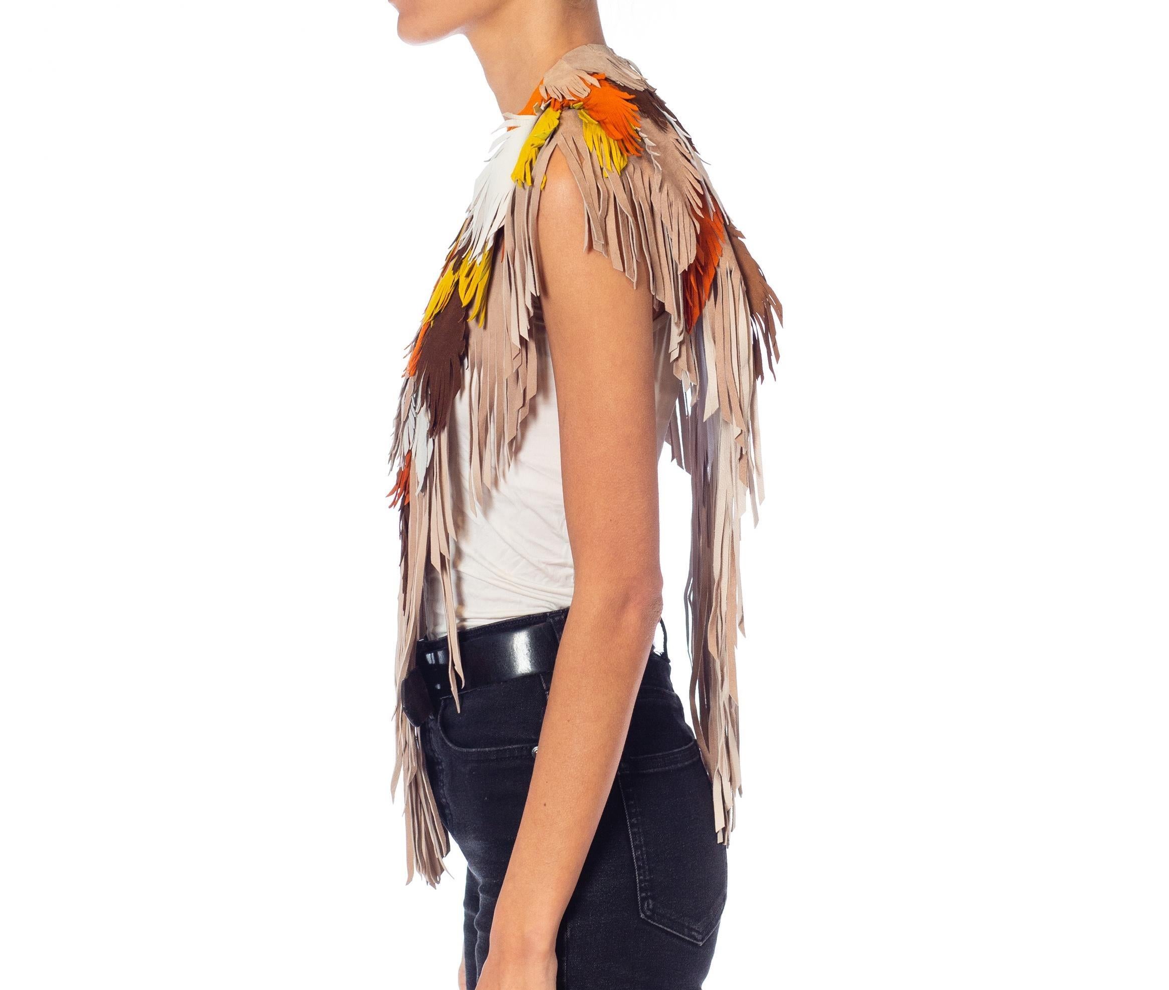 Each Feather-Leather is made by hand by our friends in Columbia in their co-op owned and operated facilities.  Morphew Collection Phoenix Sunset Suede Fringe Feather Leather Cape 
MORPHEW COLLECTION is made entirely by hand in our NYC Ateliér of
