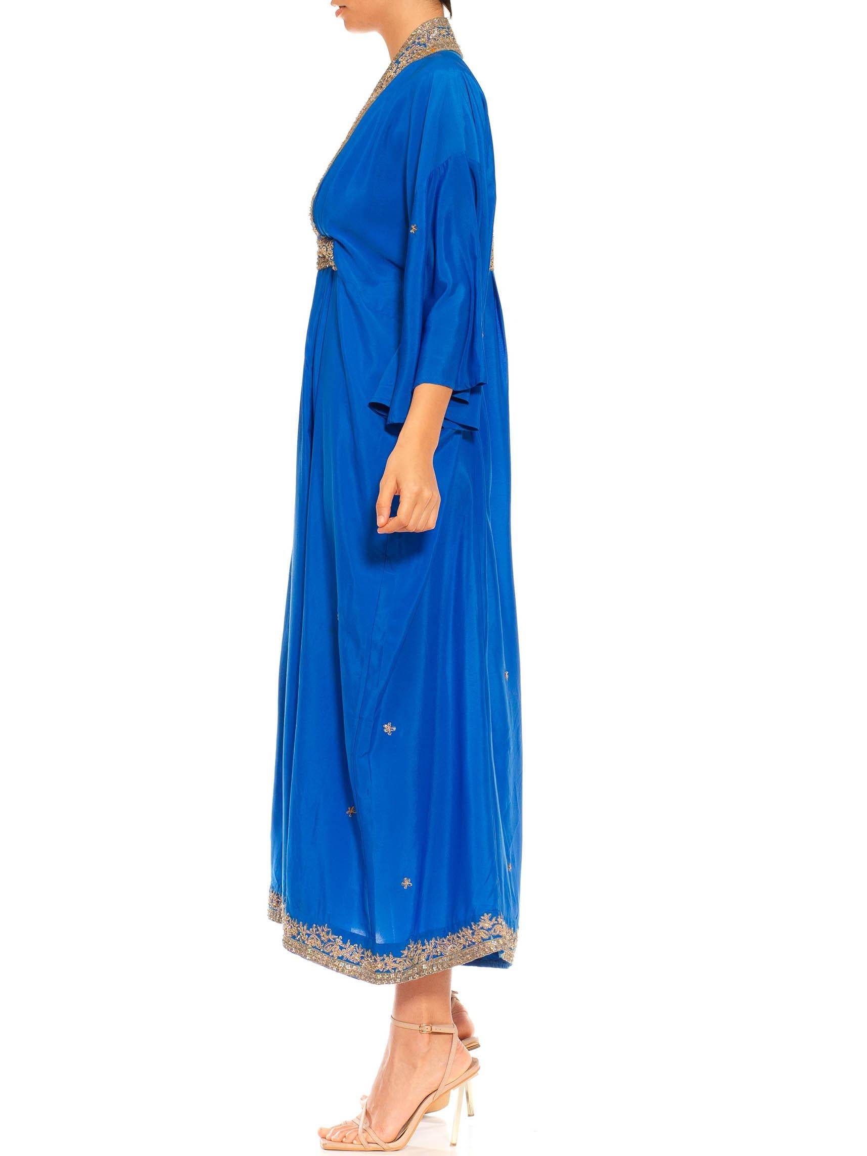Morphew Collection Royal Blue Silk Kaftan With Sequined Silver Trimmings Made From Vintage Saris
MORPHEW COLLECTION is made entirely by hand in our NYC Ateliér of rare antique materials sourced from around the globe. Our sustainable vintage
