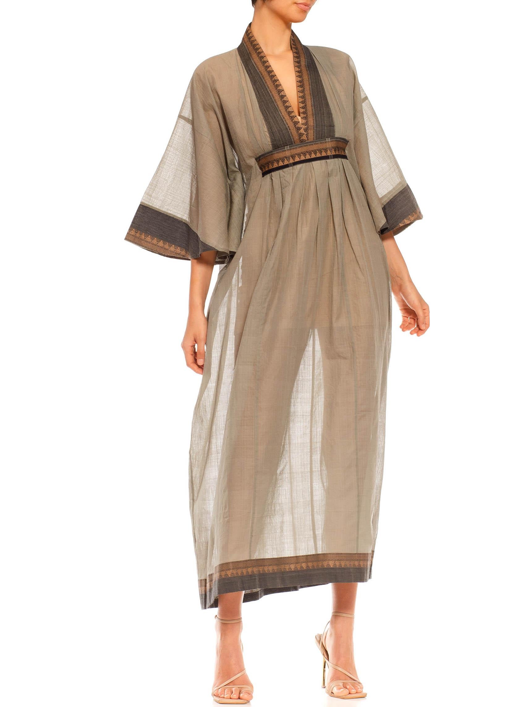 MORPHEW COLLECTION Sageoyster Grey & Black Cotton Jacquard Kaftan Made From Vintage Sari
MORPHEW COLLECTION is made entirely by hand in our NYC Ateliér of rare antique materials sourced from around the globe. Our sustainable vintage materials