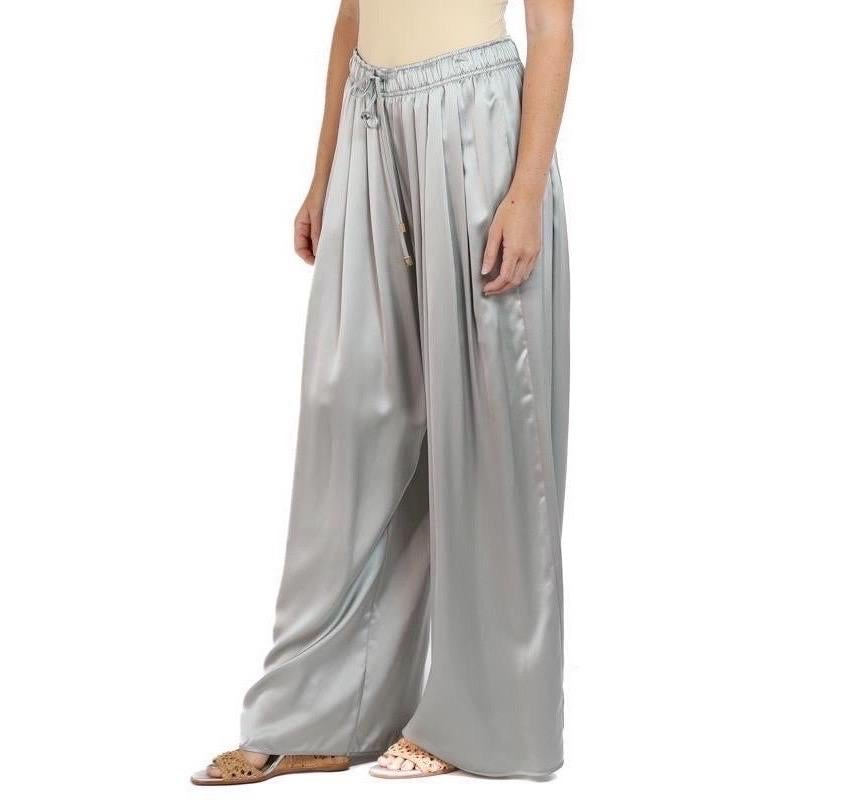 Our wide leg silk pants are like no other out there because they are pleated all the way around the body, set with an elastic waist for comfort and fit. Unstretched the waist will fit sizes  Morphew Collection Silver Silk Charmeuse Oversized Box