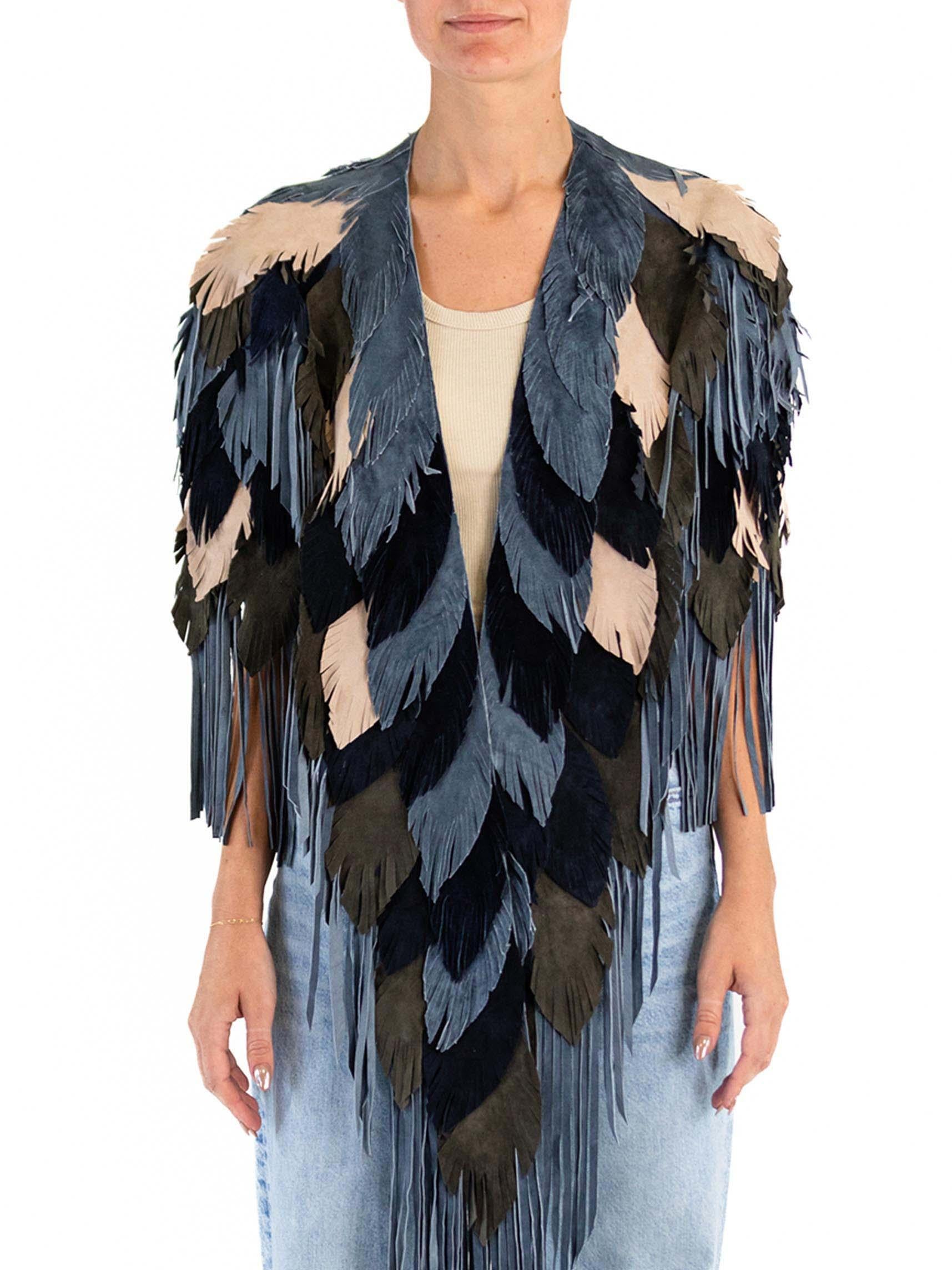 Each Feather-Leather is made by hand by our friends in Columbia in their co-op owned and operated facilities.  MORPHEW COLLECTION Suede Fringe Feather Leather Long Cape 
MORPHEW COLLECTION is made entirely by hand in our NYC Ateliér of rare antique