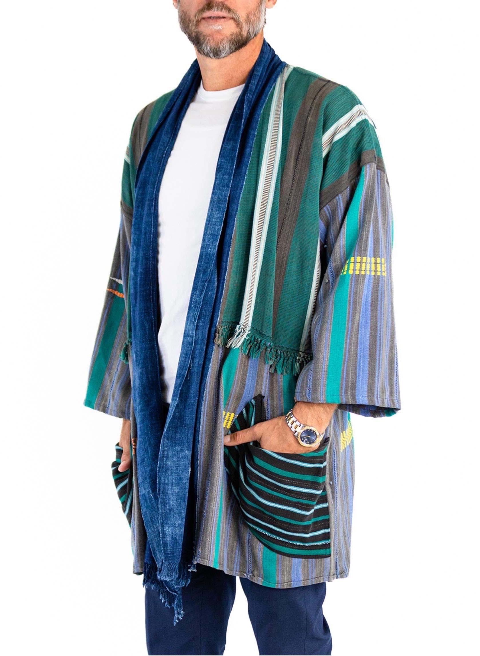 MORPHEW COLLECTION West African Indigo Cotton Green And Black Striped Beach Coat Duster
MORPHEW COLLECTION is made entirely by hand in our NYC Ateliér of rare antique materials sourced from around the globe. Our sustainable vintage materials