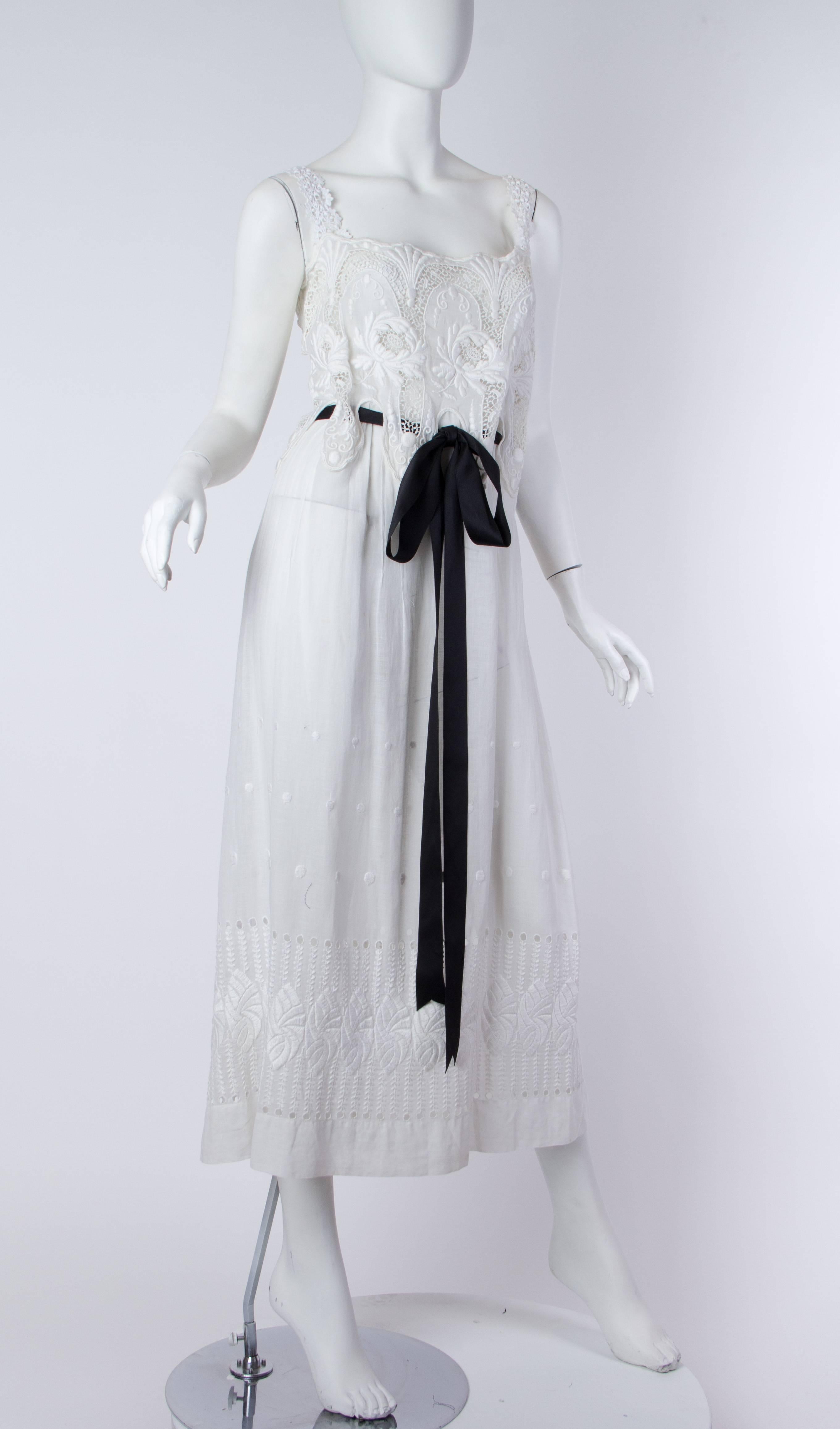MORPHEW COLLECTION White Victorian Cotton Voile Dress With Lace Details & Black Ribbon Belt
MORPHEW COLLECTION is made entirely by hand in our NYC Ateliér of rare antique materials sourced from around the globe. Our sustainable vintage materials