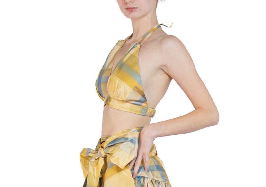 This top is made from a mixed lot of deadstock vintage 1990s silk taffeta which we discovered in an old warehouse. The top can be adjusted and worn in two ways. A limited amount of these were made and they are designed to mix and match with our