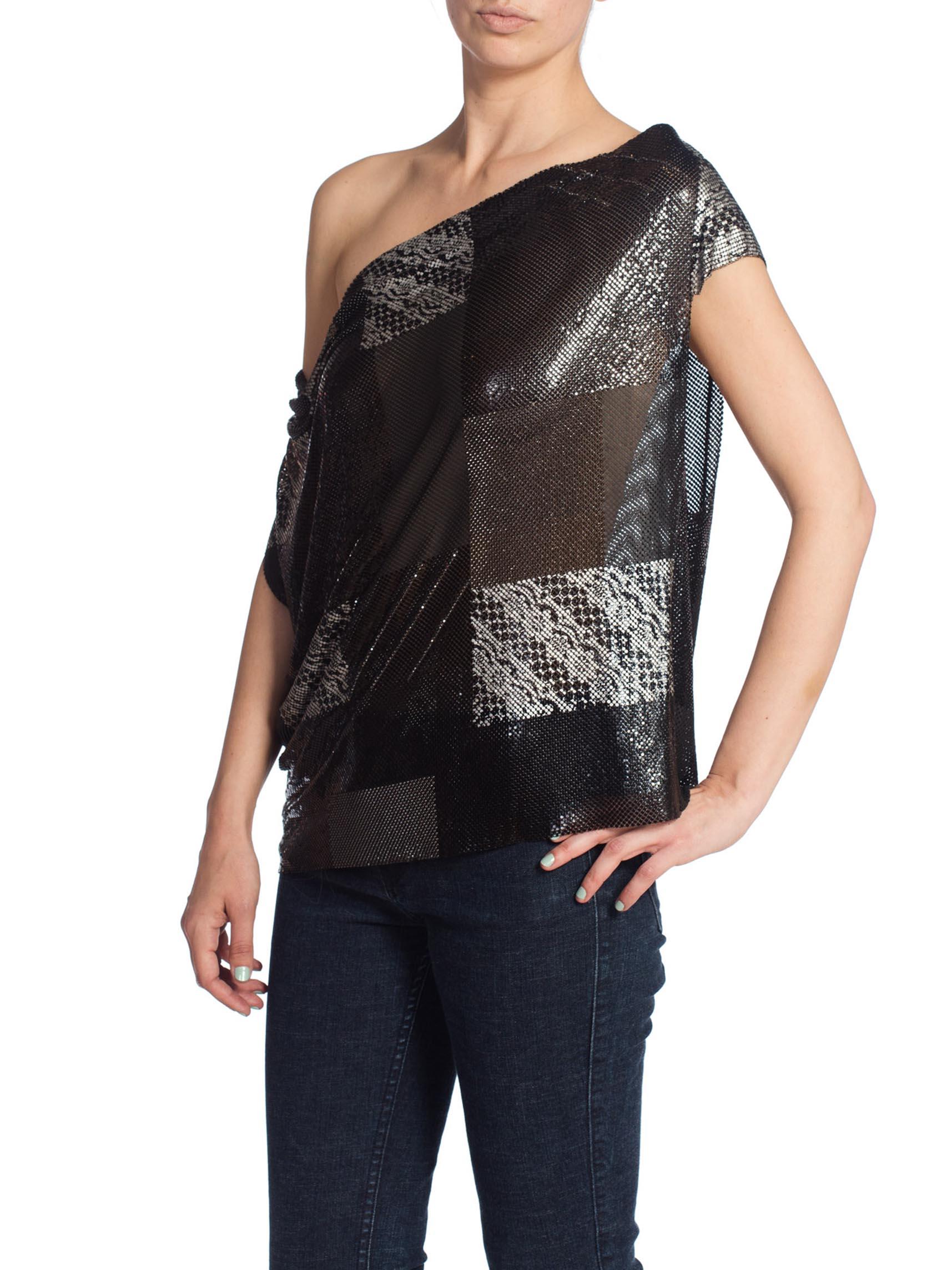 MORPHEW COLLECTION Patch Work Metal Mesh Top In Black With Crystals
MORPHEW COLLECTION is made entirely by hand in our NYC Ateliér of rare antique materials sourced from around the globe. Our sustainable vintage materials represent over a century of