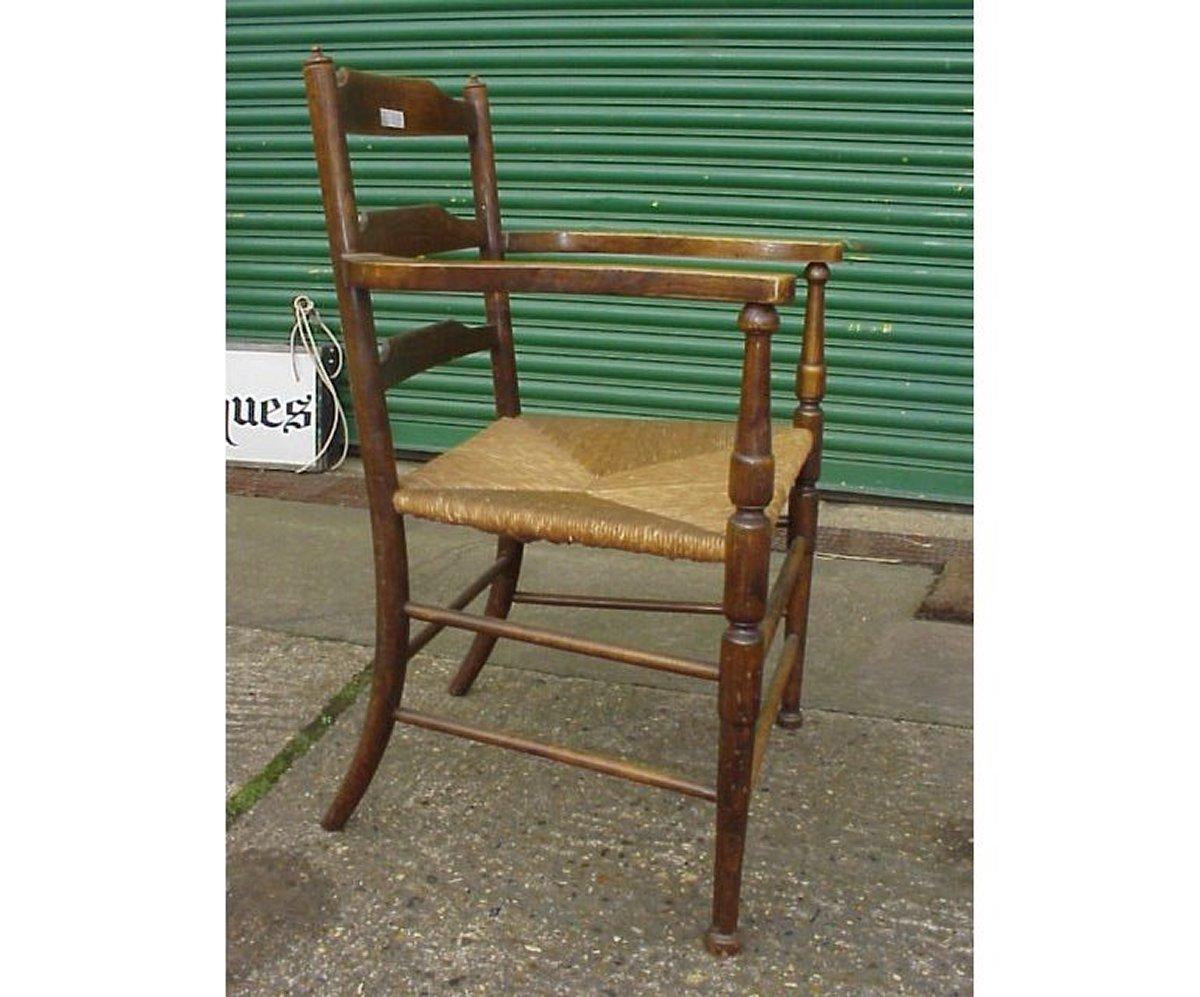 Morris and Co., A rare ash ladder back rush seat armchair. These armchairs were designed to offer a more traditional English vernacular style armchair. It would seem that they were made in very small numbers or the style which closely resembles