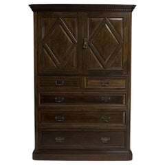 Morris & Co. An Aesthetic Movement Walnut tallboy with internal sliding drawers.