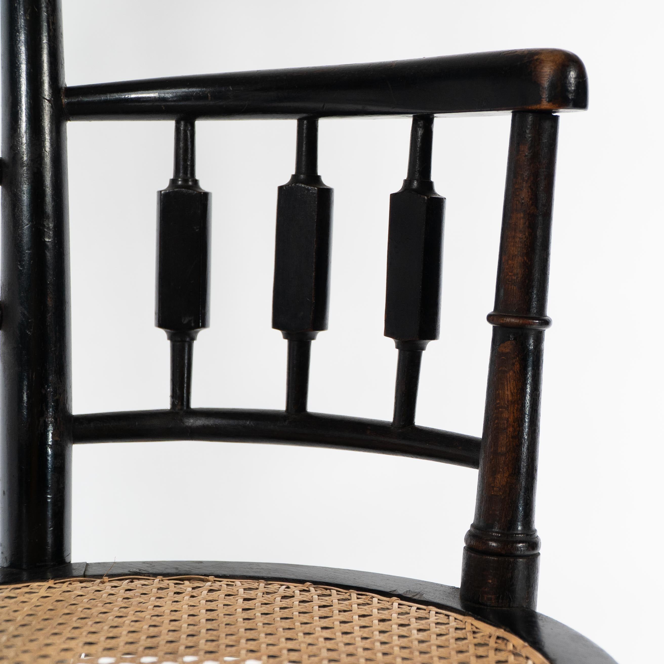 Morris and Co. An Aesthetic Movement cane seated armchair For Sale 2