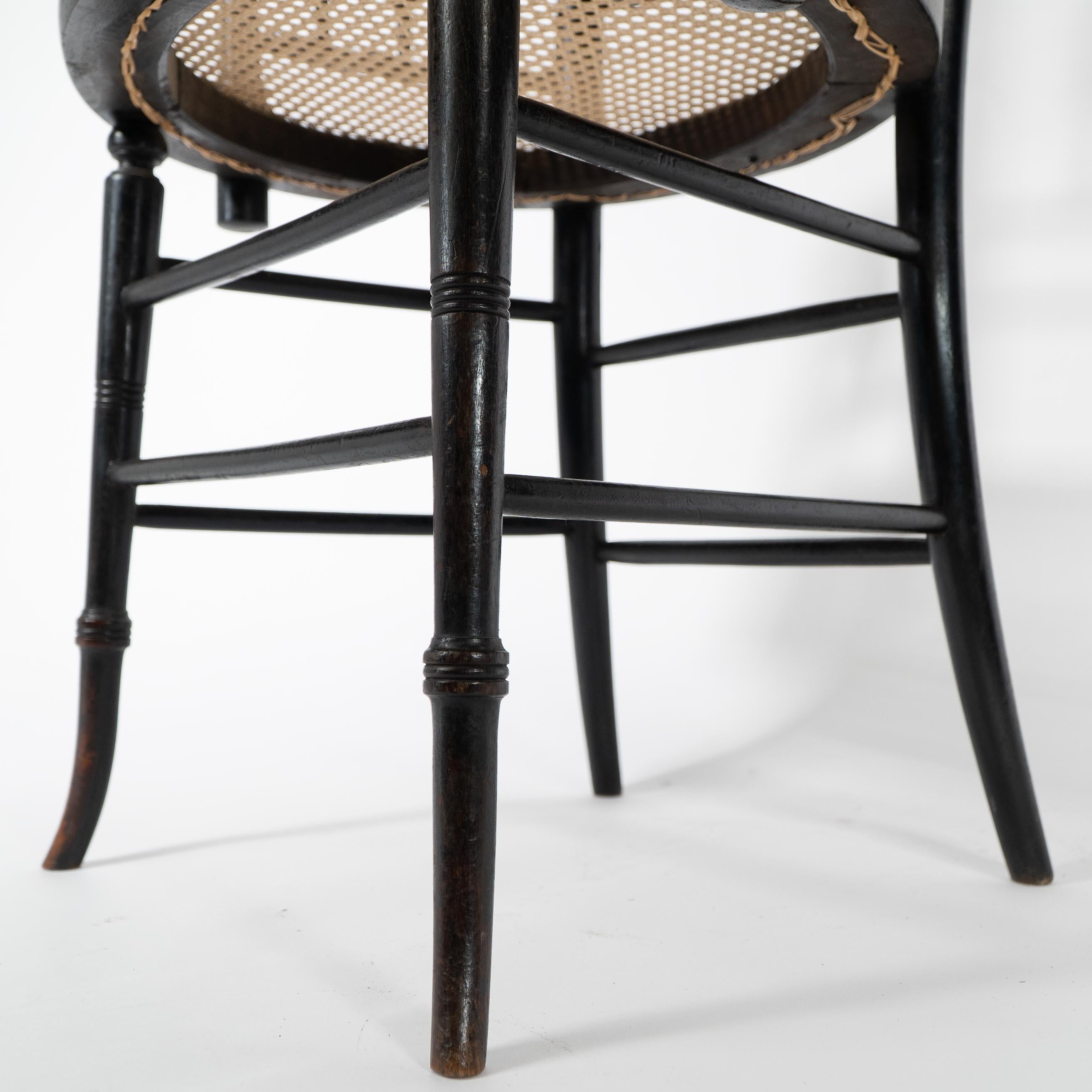 Morris and Co. An Aesthetic Movement cane seated armchair For Sale 4