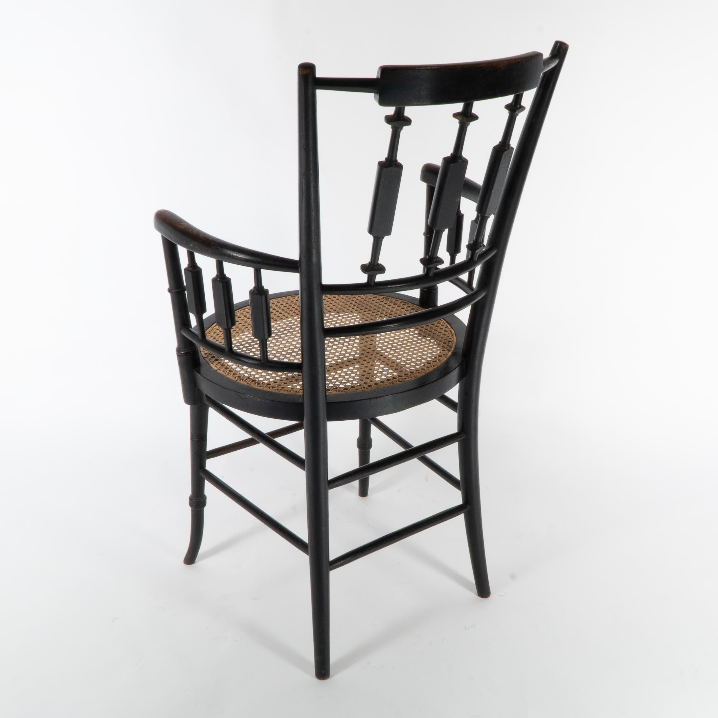 Morris and Co. An Aesthetic Movement cane seated armchair For Sale 8