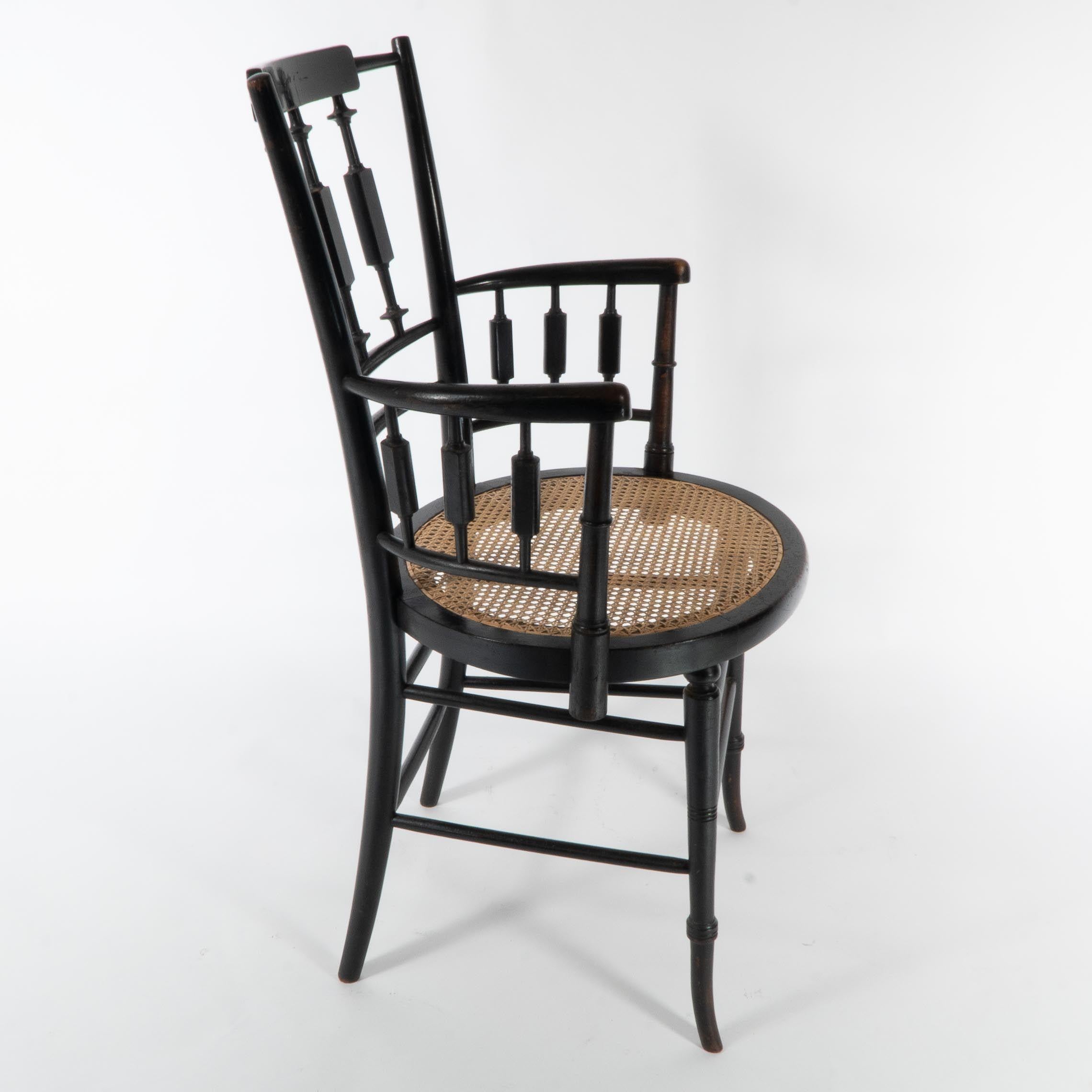 English Morris and Co. An Aesthetic Movement cane seated armchair For Sale