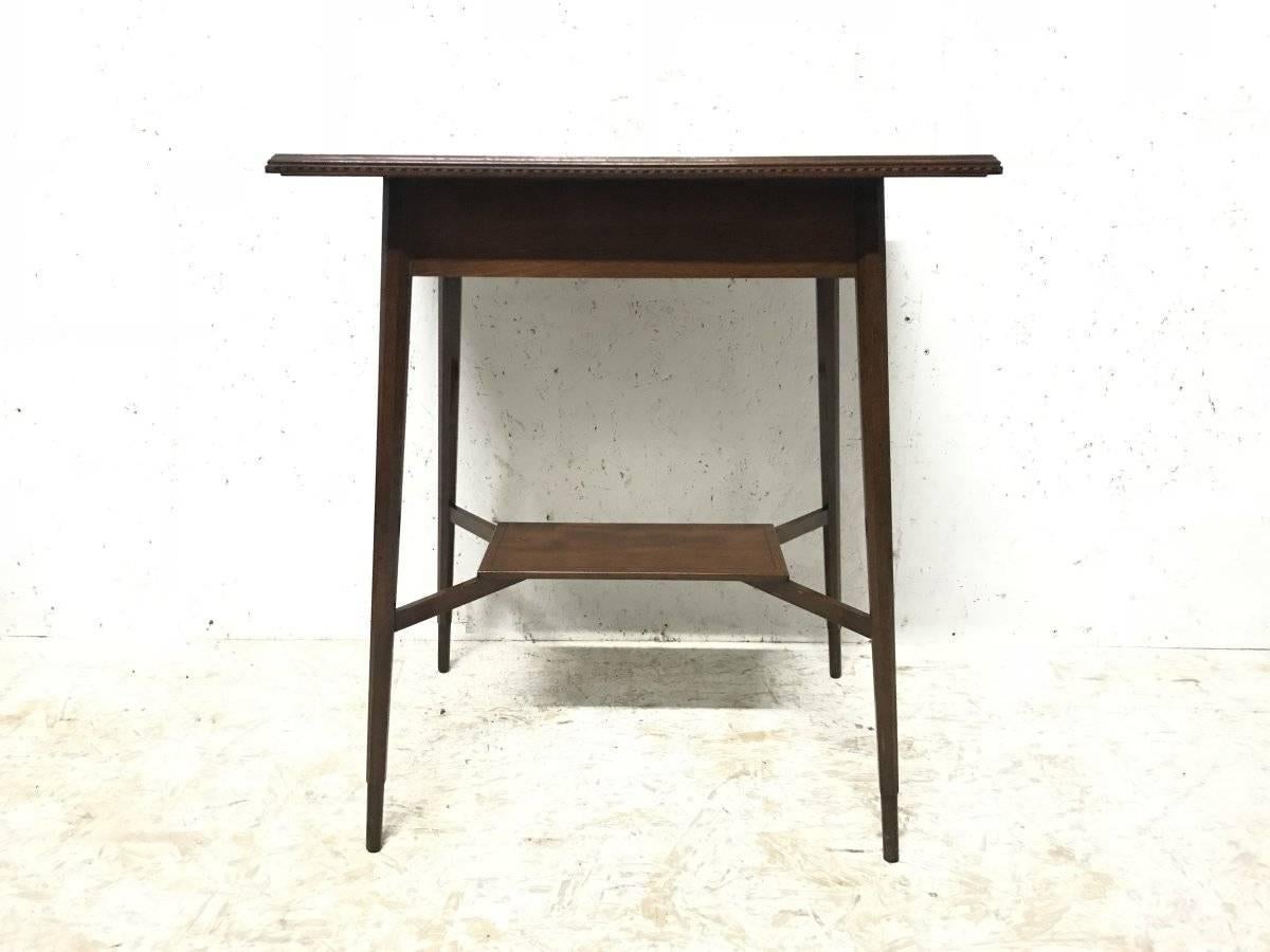 Morris and Co. Designed by George Jack. A superior quality walnut side table.