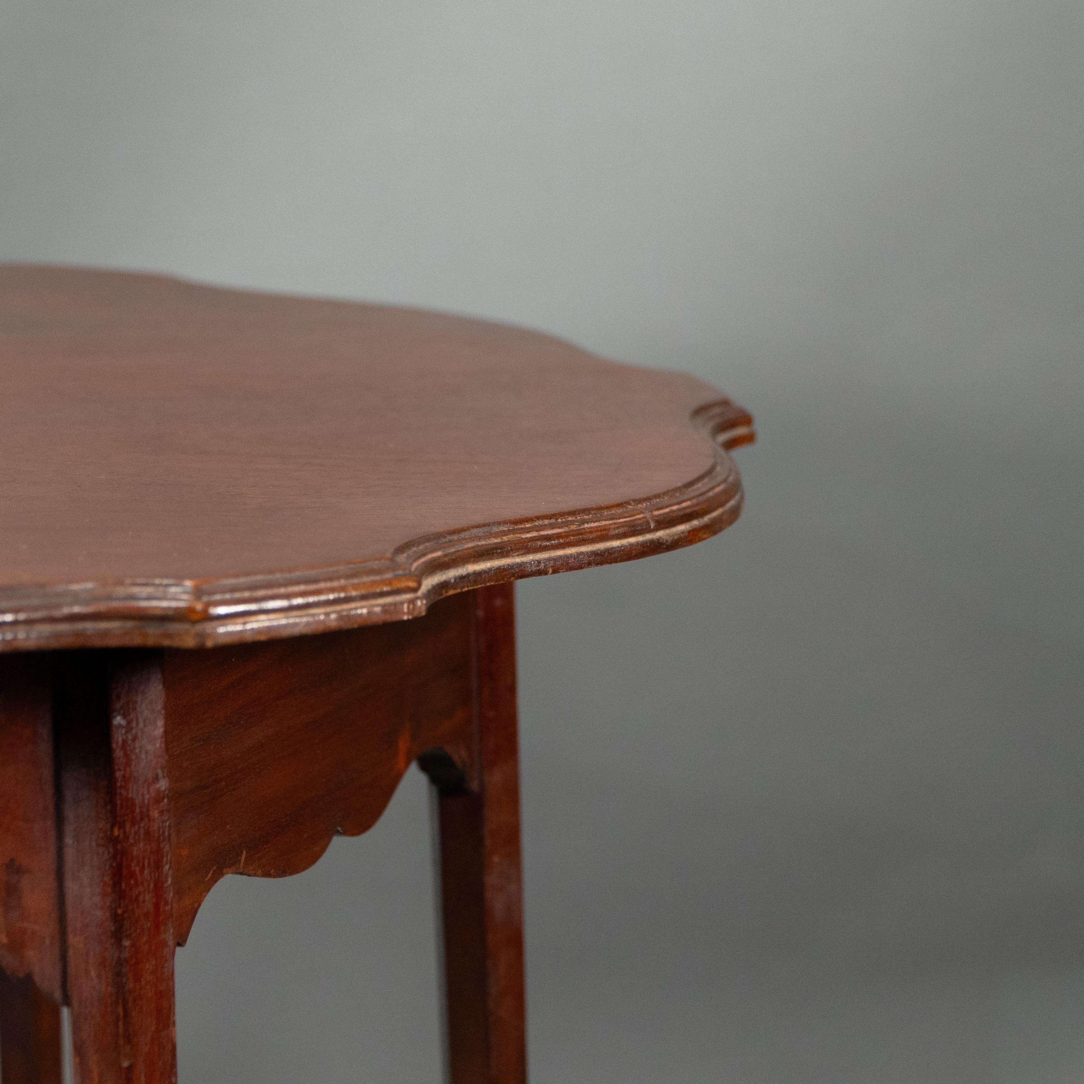 Morris and Co. Walnut side table with a shaped top and a wavey apron. For Sale 9