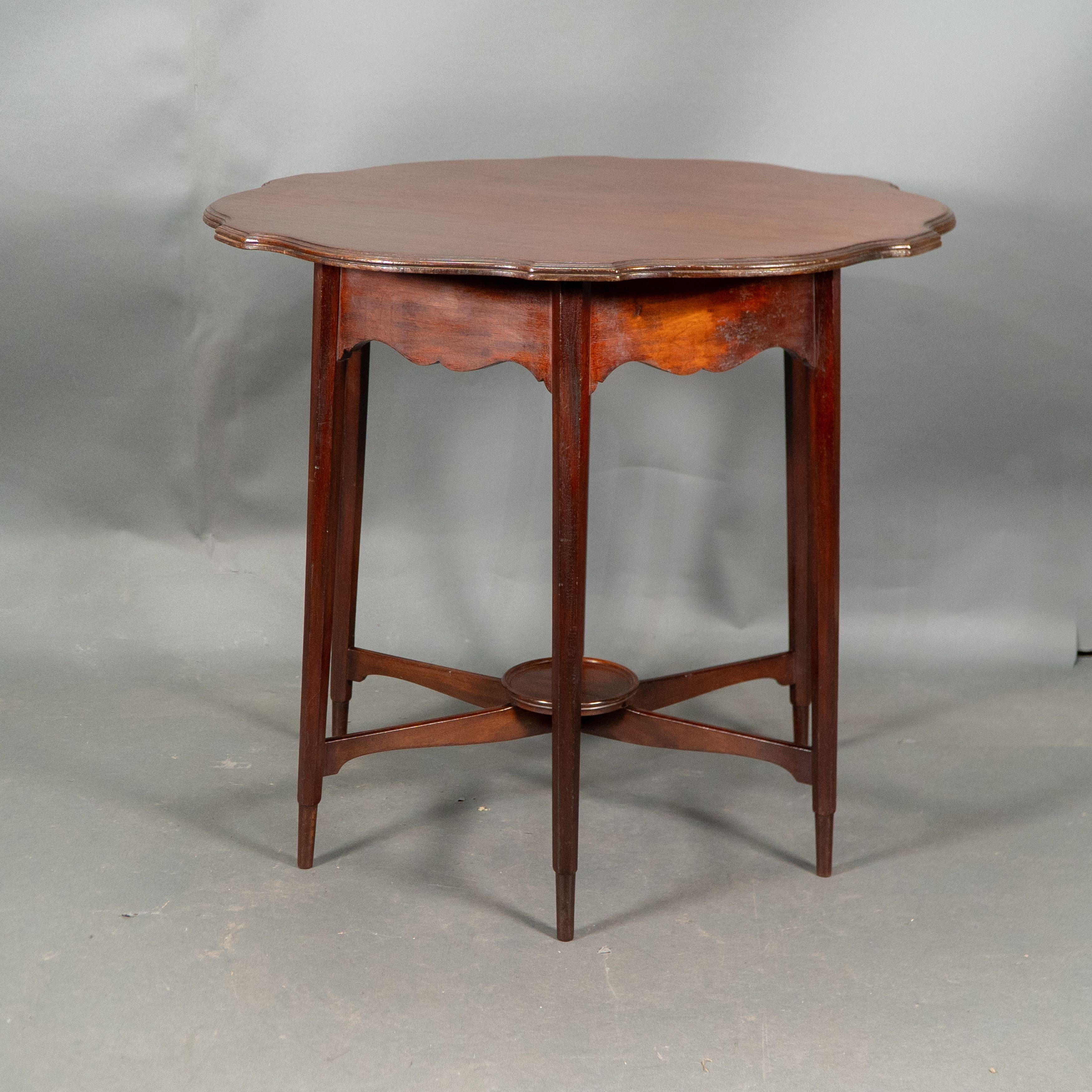 Morris and Co. Walnut side table with a shaped top and a wavey apron. In Good Condition For Sale In London, GB
