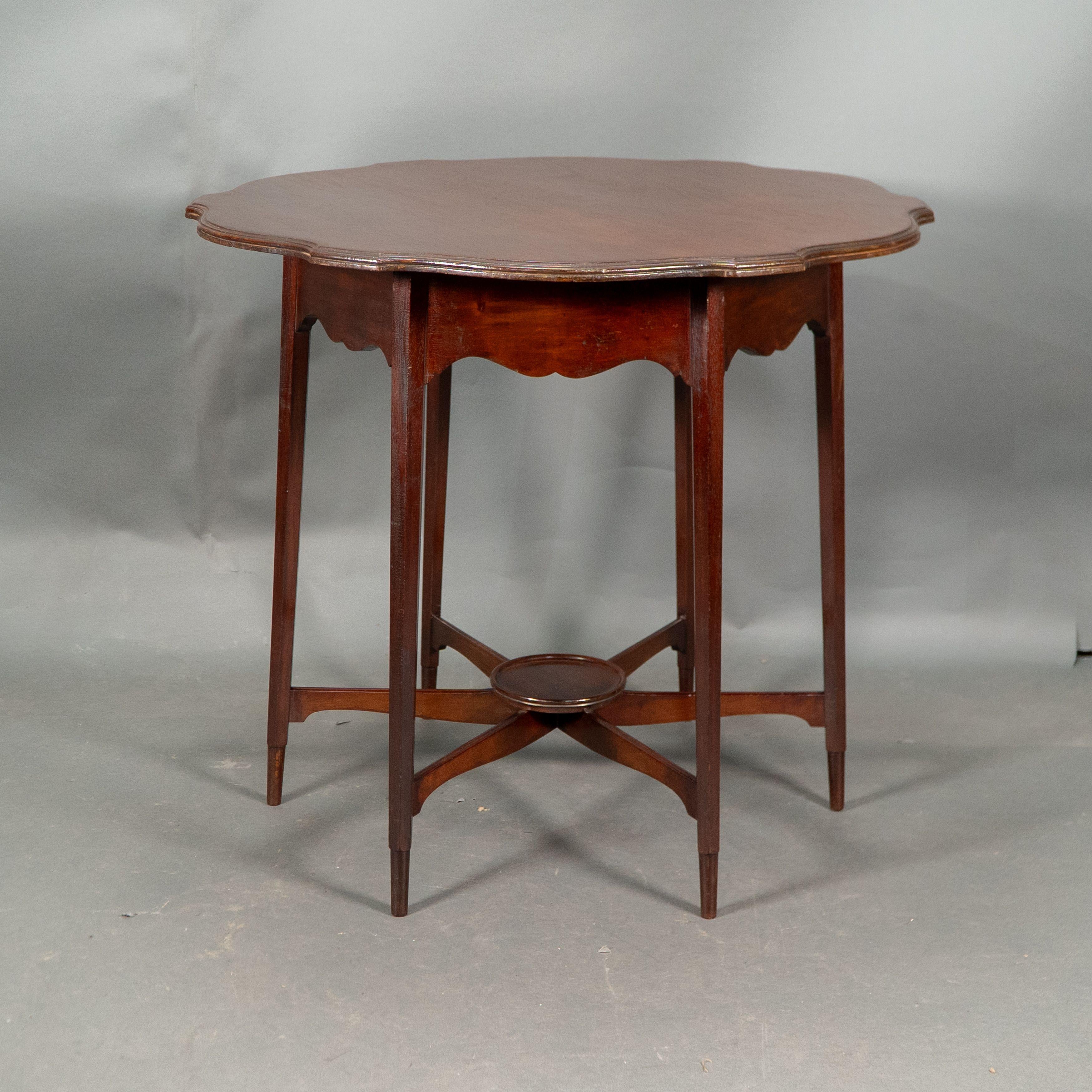 Morris and Co. Walnut side table with a shaped top and a wavey apron. For Sale 1