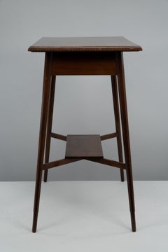 Morris & Co. A fine quality Aesthetic Movement walnut side table.