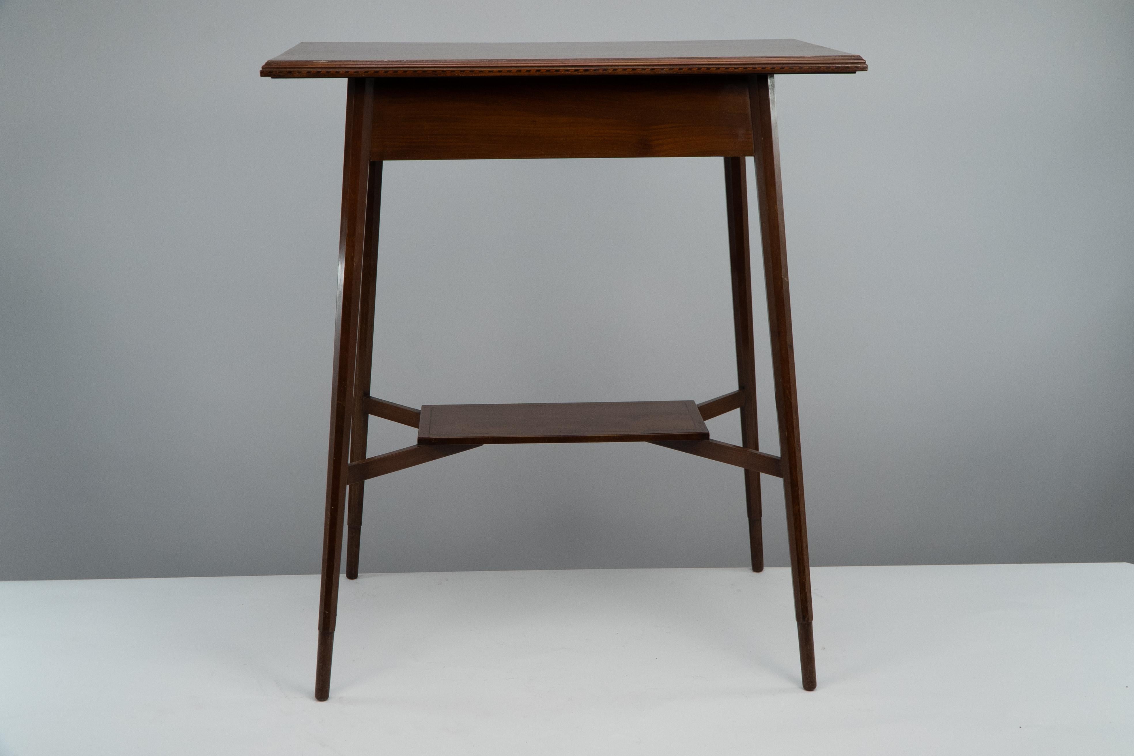 English Morris & Co. A fine quality Aesthetic Movement walnut side table. For Sale