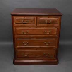Morris & Co. An Arts & Crafts walnut chest of drawers with finely cast handles