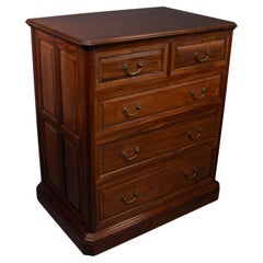 Antique Morris & Co. An Arts & Crafts walnut chest of drawers with finely cast handles