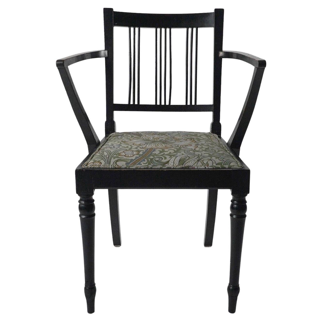 Morris & Co attributed. An Arts & Crafts beech armchair with Morris fabric seat.