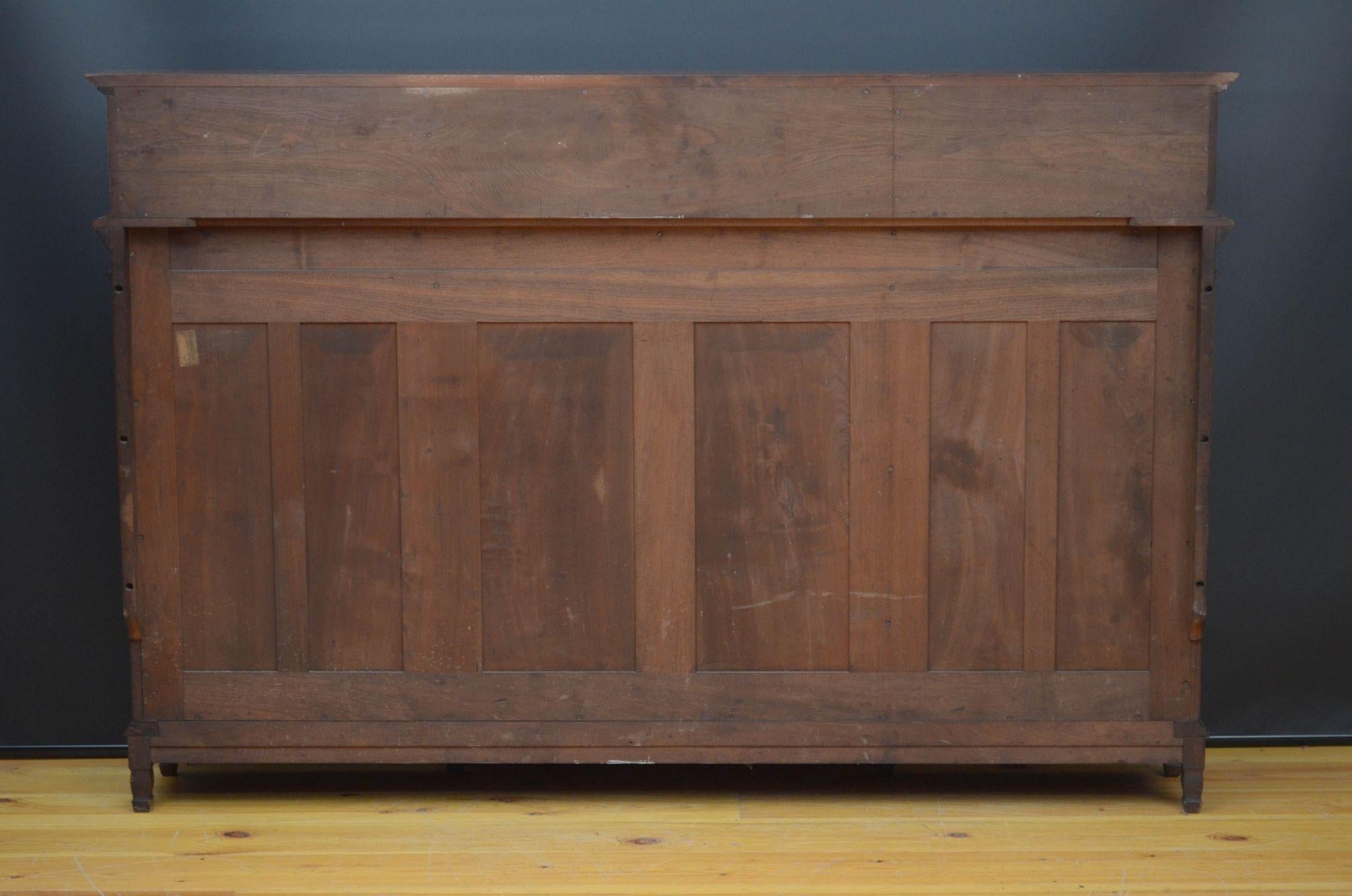 A quality walnut bookcase by Morris and co, designed by George Jack 12