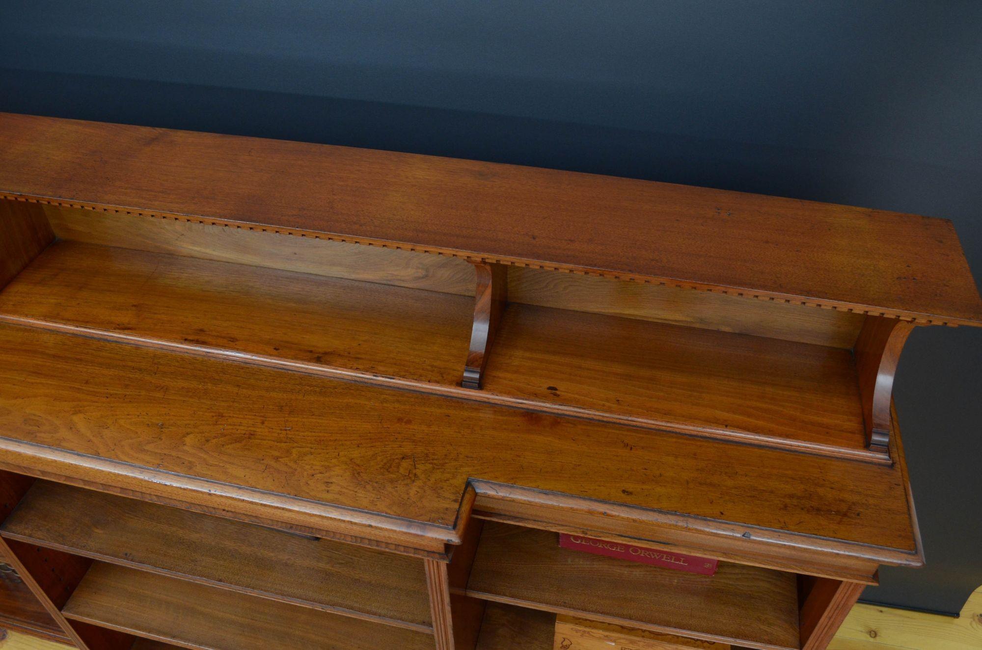 A quality walnut bookcase by Morris and co, designed by George Jack 1
