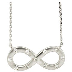 Morris 
David 14 Karat White Gold 0.11 Carat Diamond Infinity Pendant