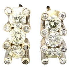 Morris 
David 14 Karat White Gold 1.40 Carat Diamond Huggie Earrings
