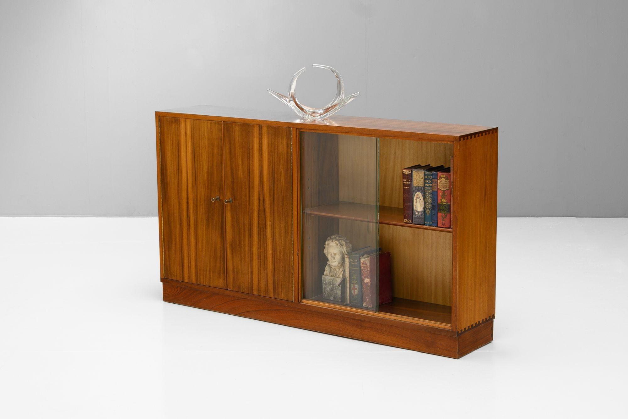 Glazed bookcase by Morris of Glasgow from the Cumbrae range in walnut with brass handles. U.K circa 1960.
H 78cm x W 136cm x D 31cm