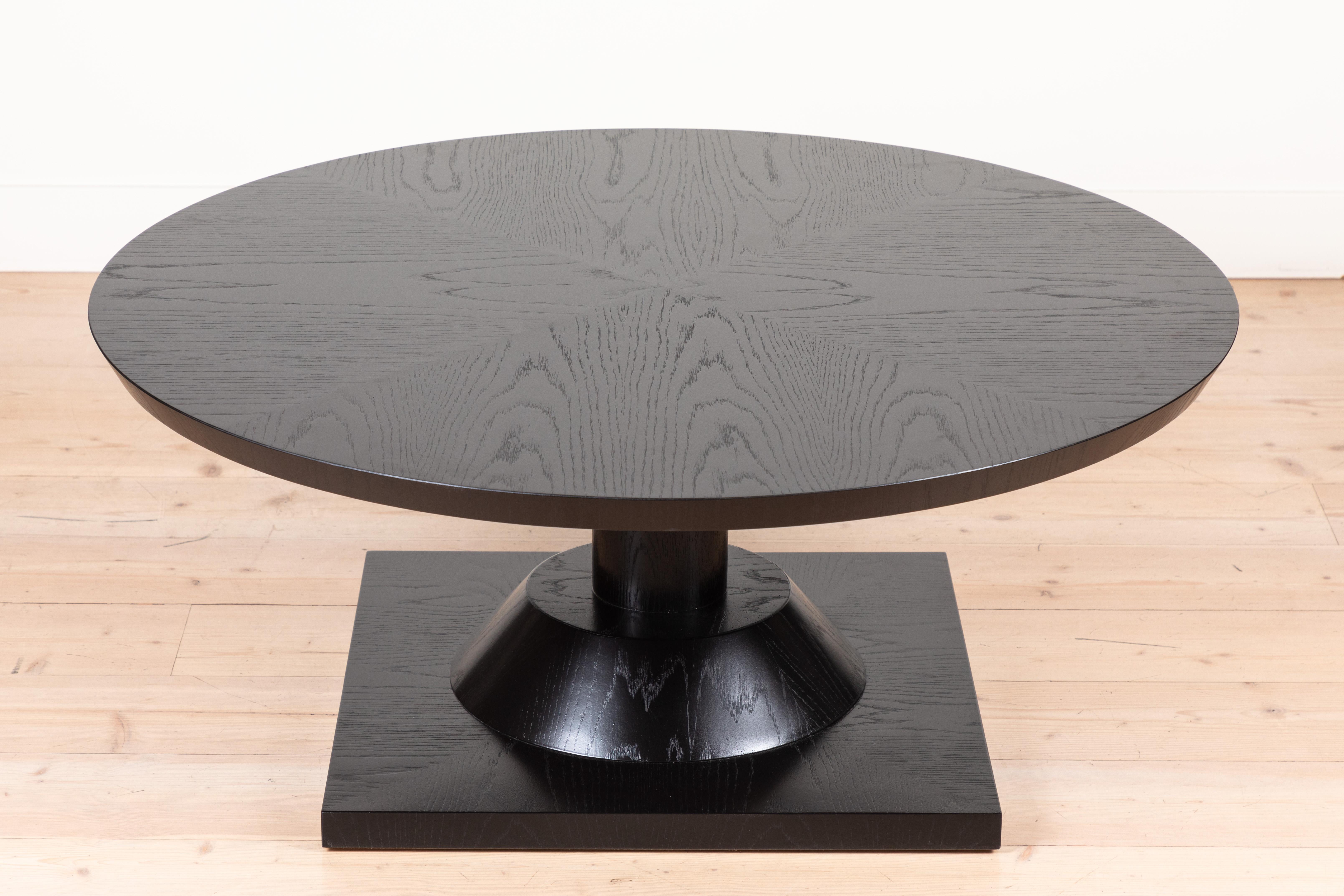 The Morro coffee table features a series of geometric shapes stacked on top of each other with solid wood details. Available in American walnut or white oak. Shown here in ebonized oak. 

Available to order in various finishes with a 10-12 week